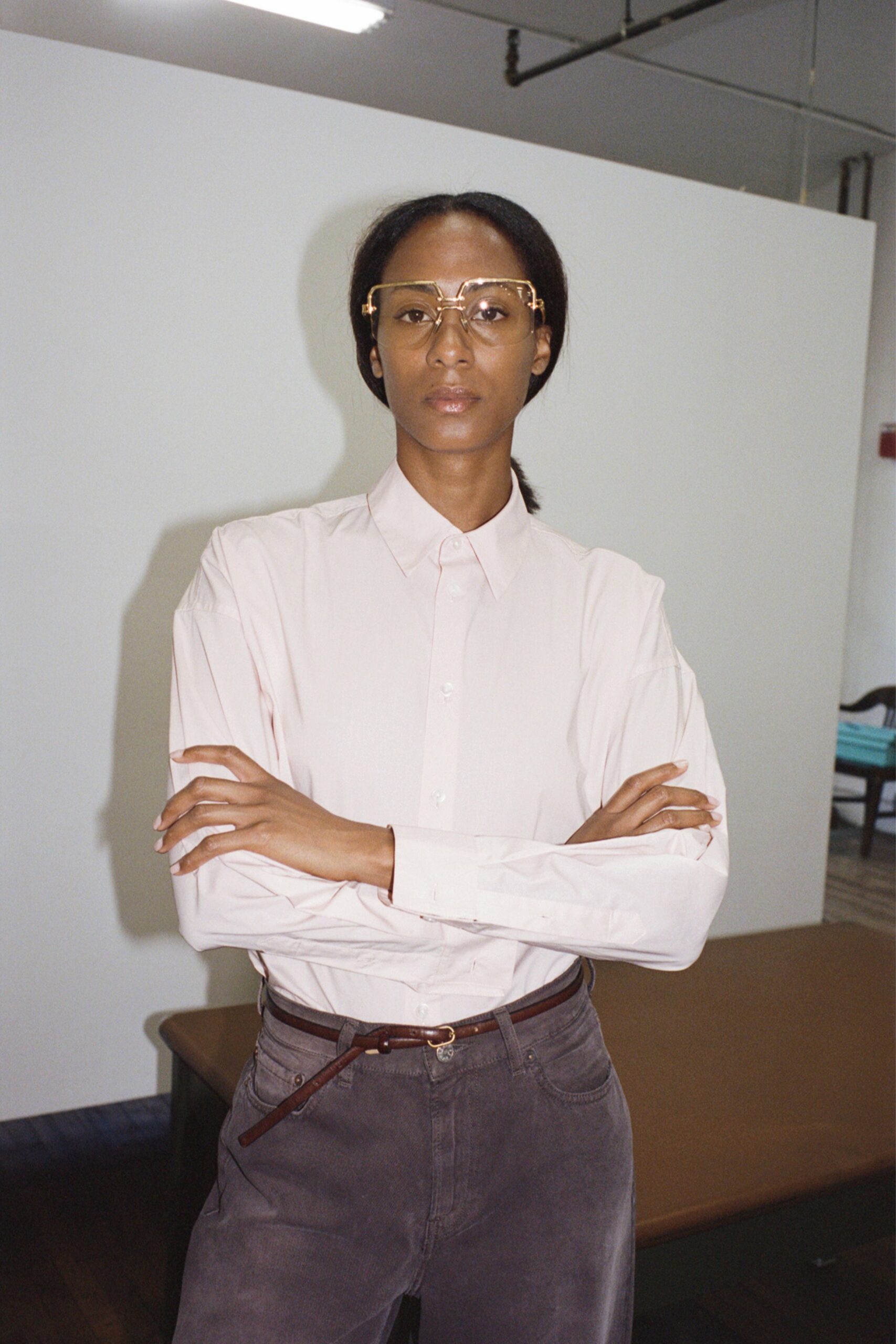pink fitted shirt with gray pants