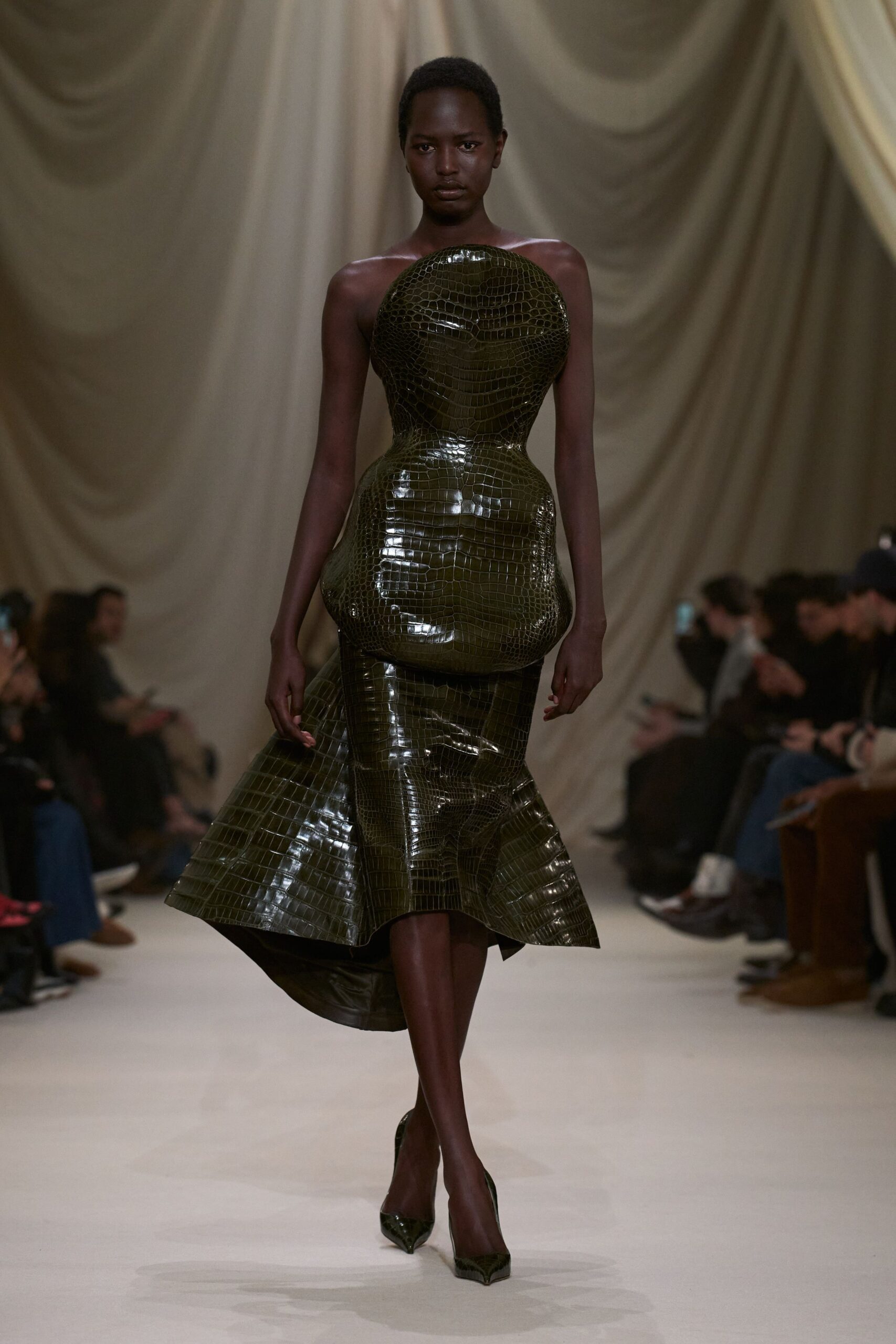 green vinyl sleeveless high-neck fitted structured pleated gown