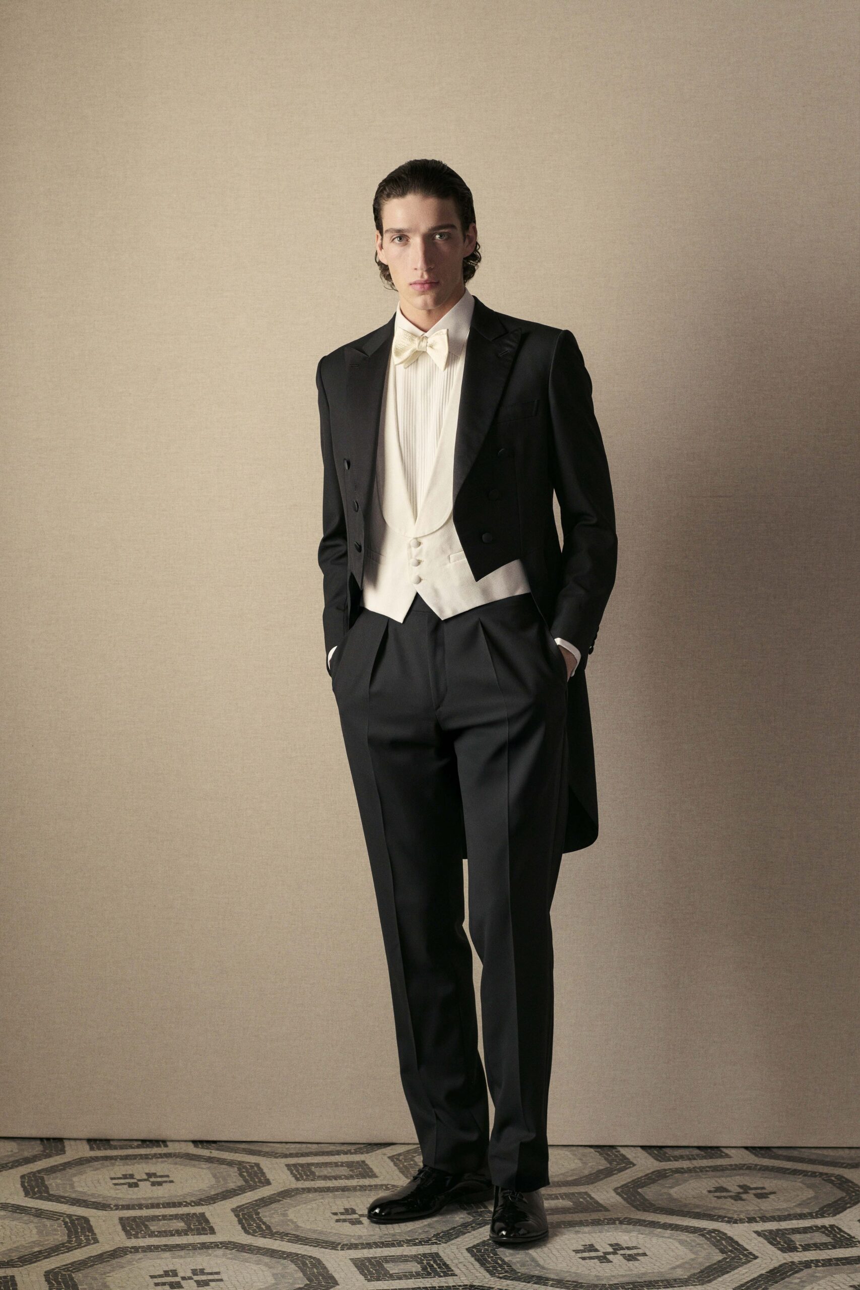 black tailored suit with ivory vest
