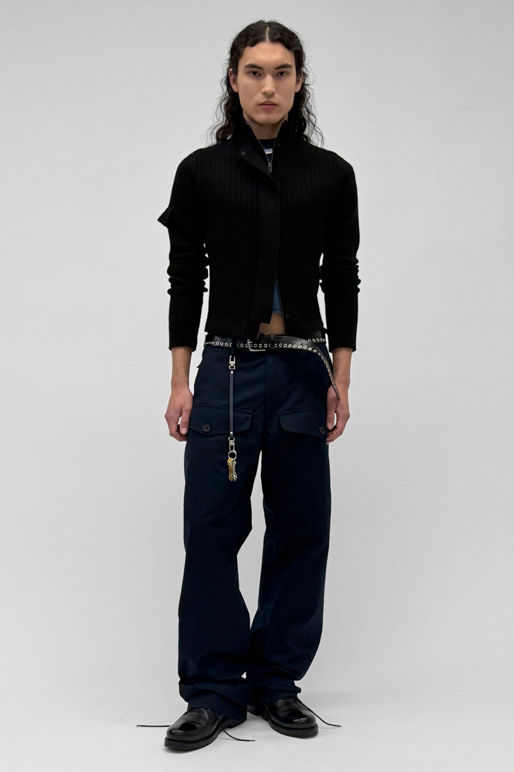 black fitted top with blue cargo pants