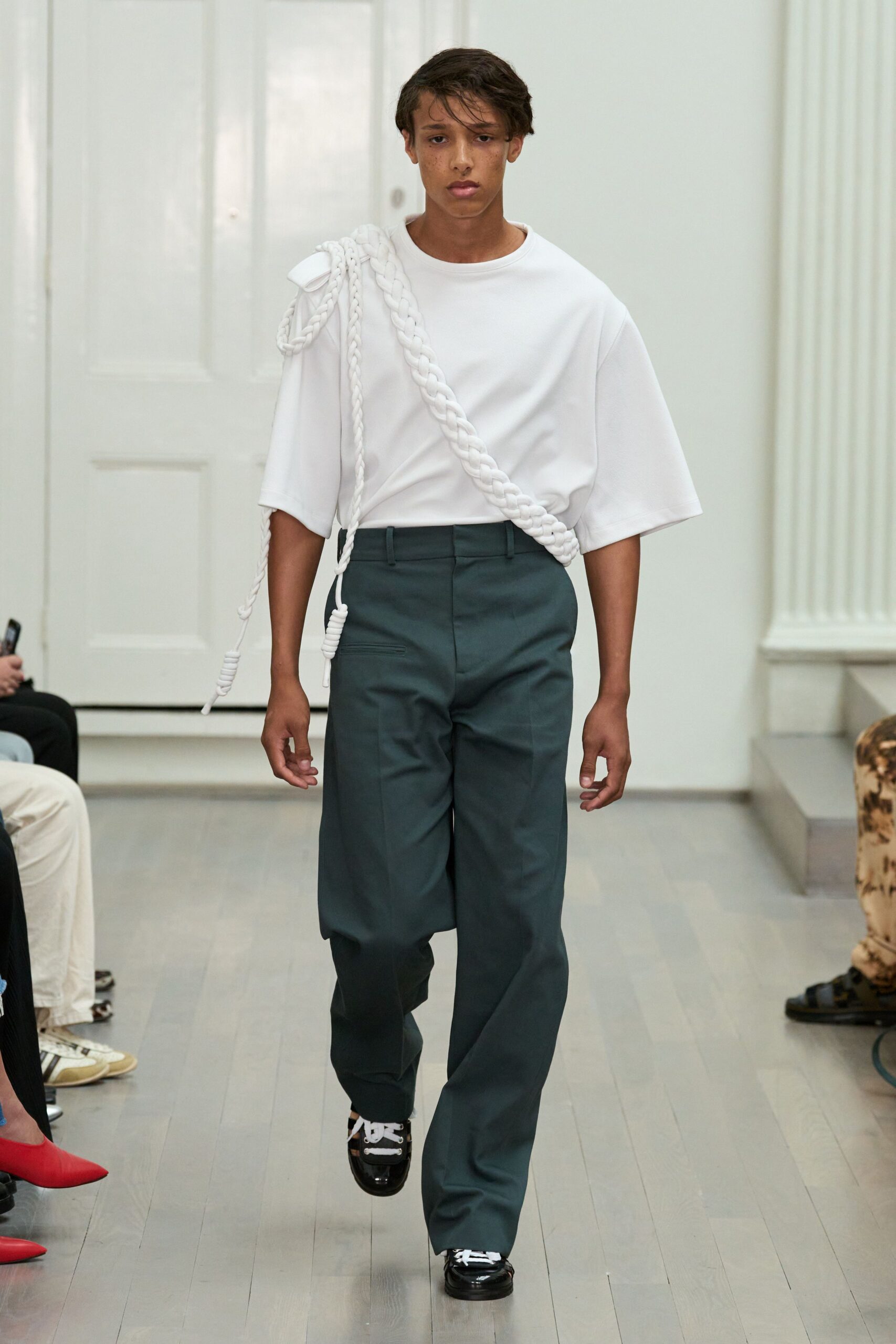 white relaxed top with green tailored pants