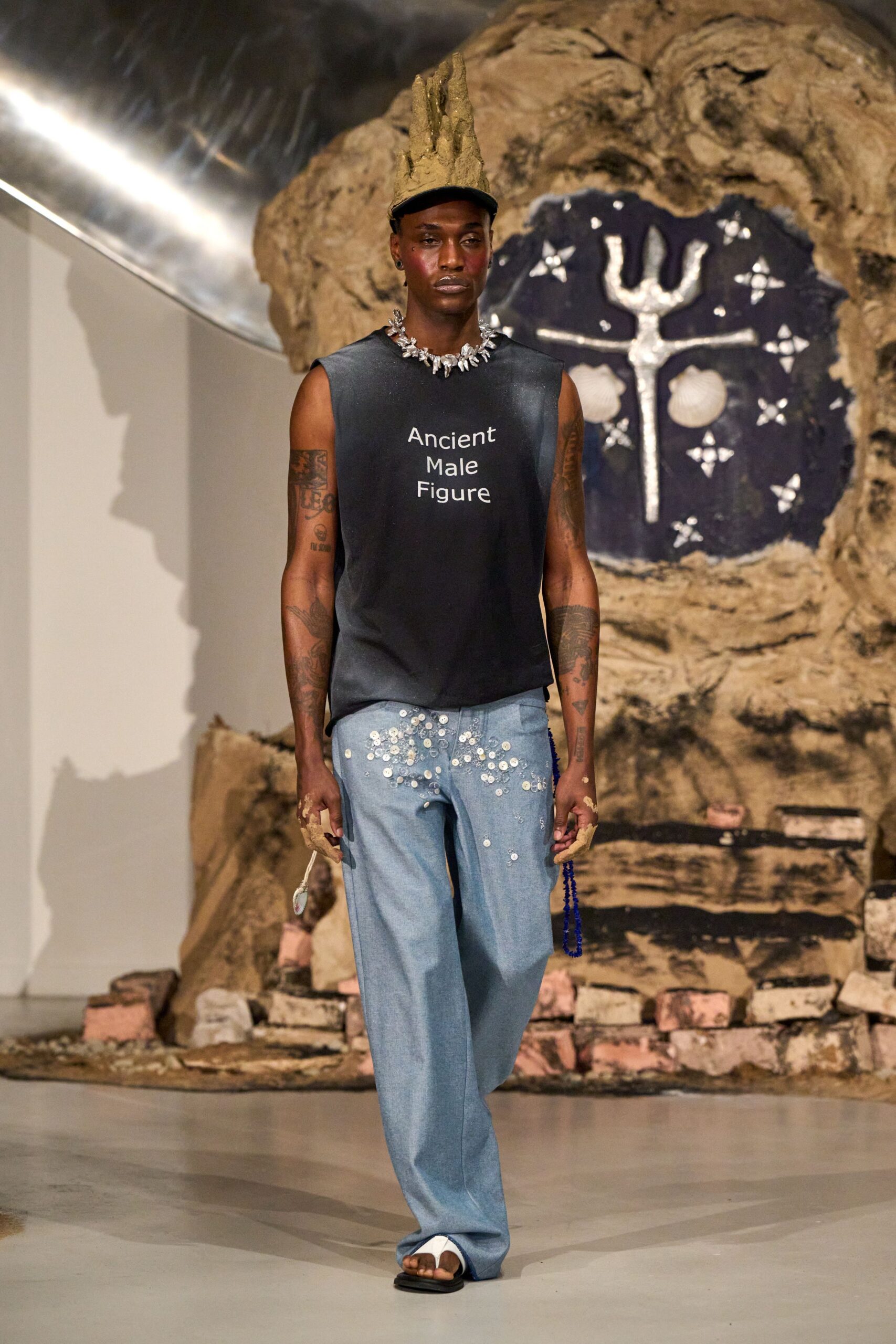 black tank-top blue distressed pants