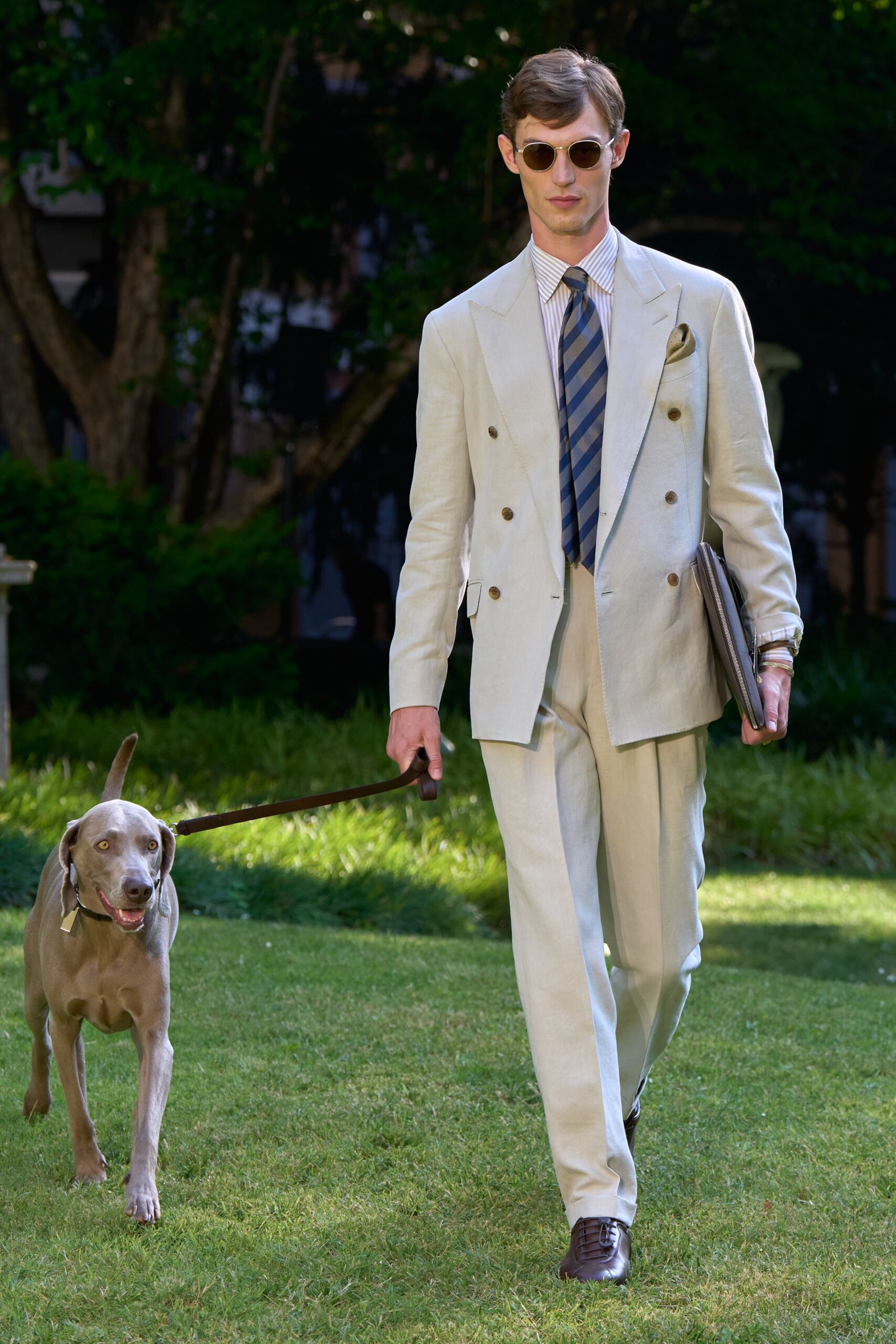 beige tailored suit with sunglasses