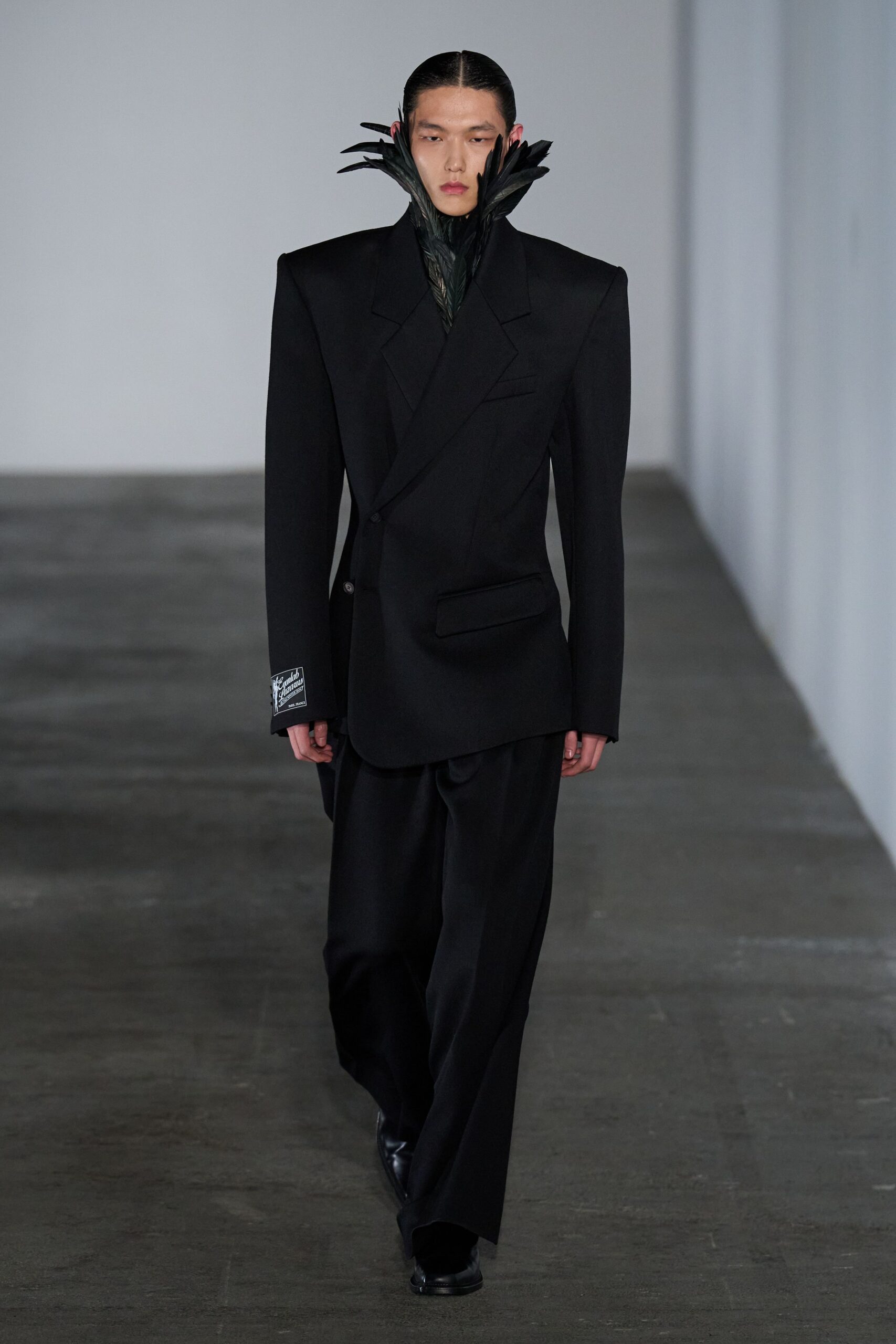 black structured blazer and relaxed pants