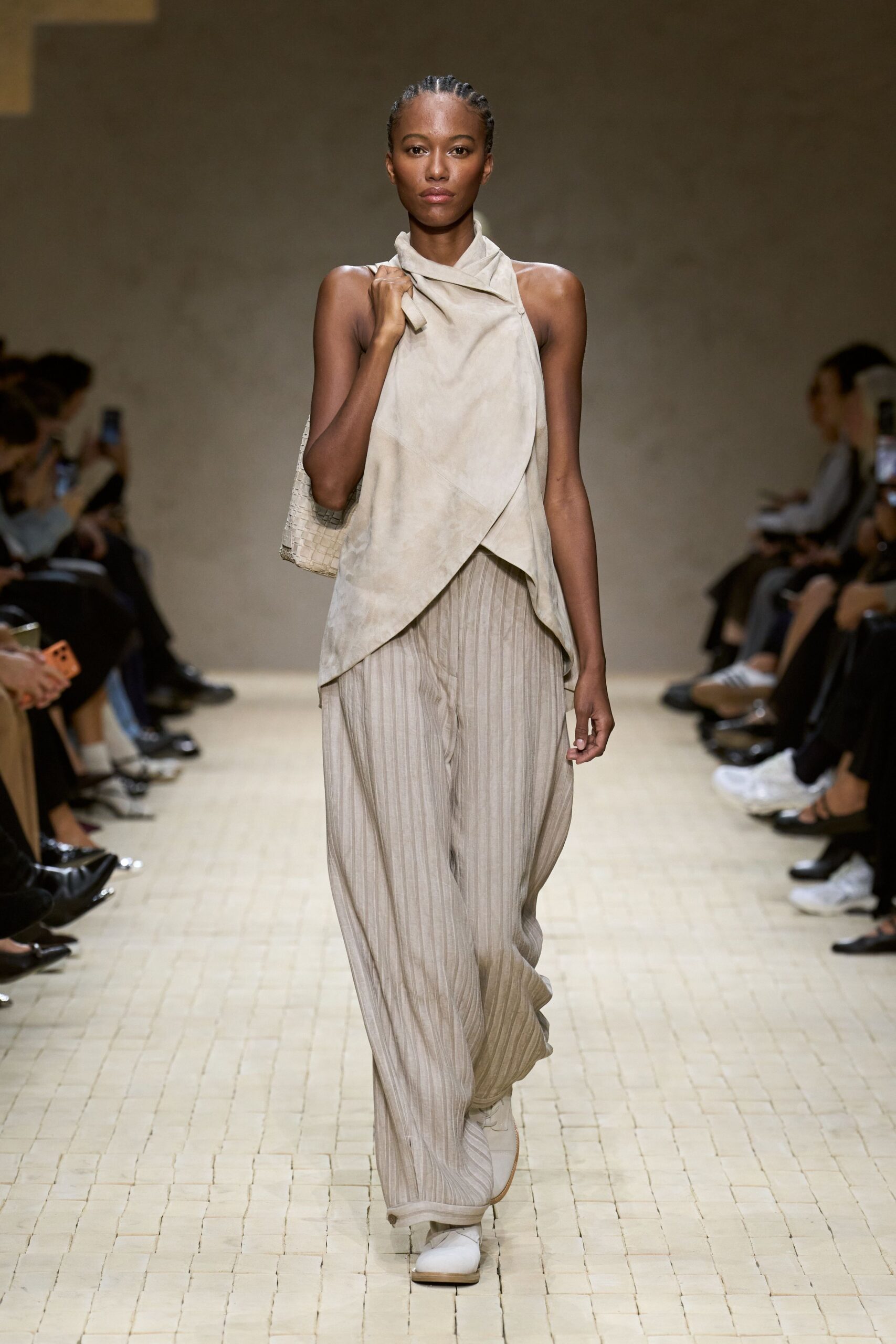beige draped top and wide-leg pants