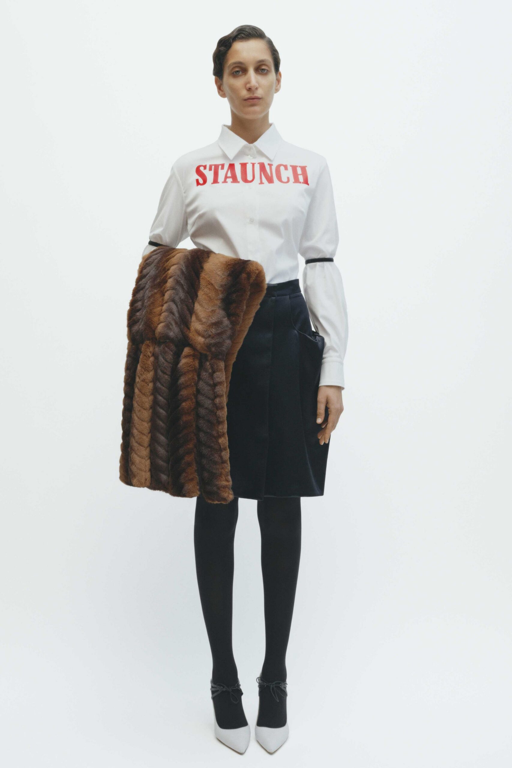 white shirt black skirt brown coat
