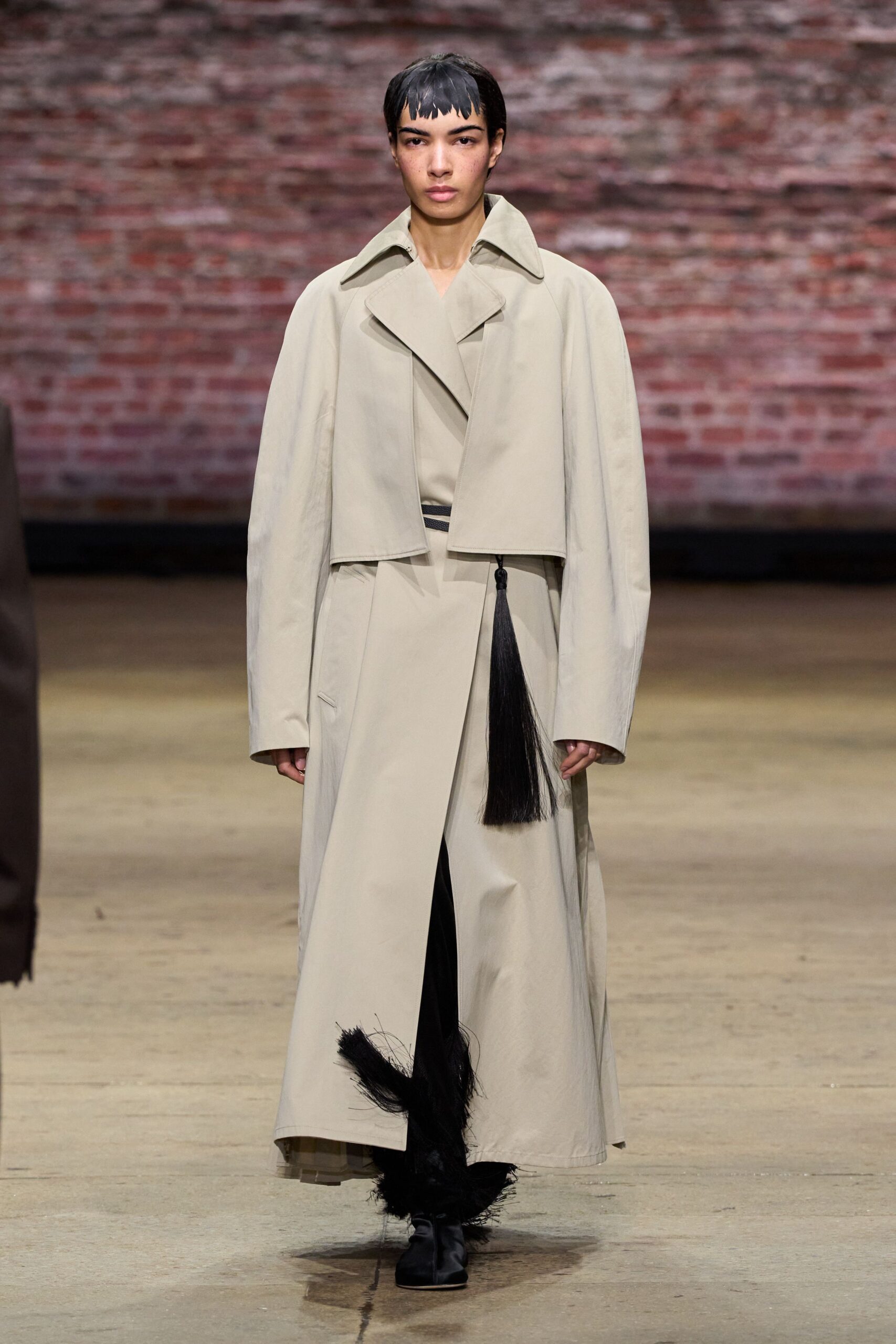 beige belted coat with black shoes