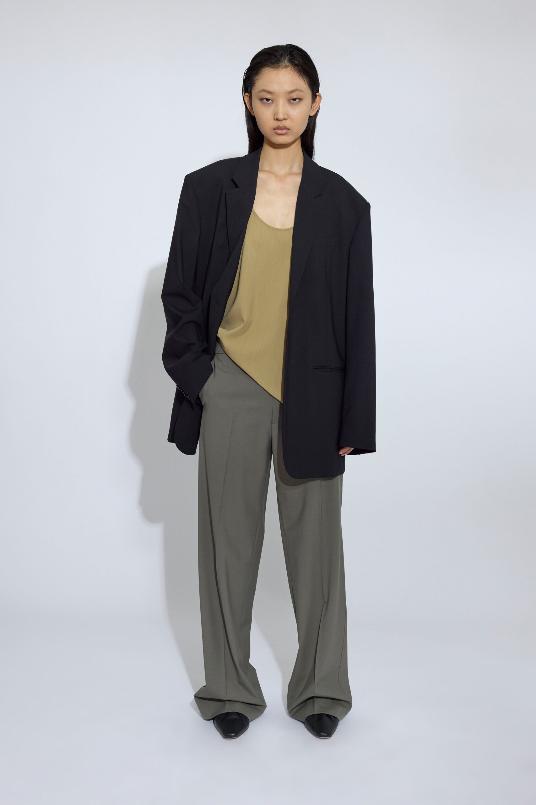 oversized black blazer with beige top