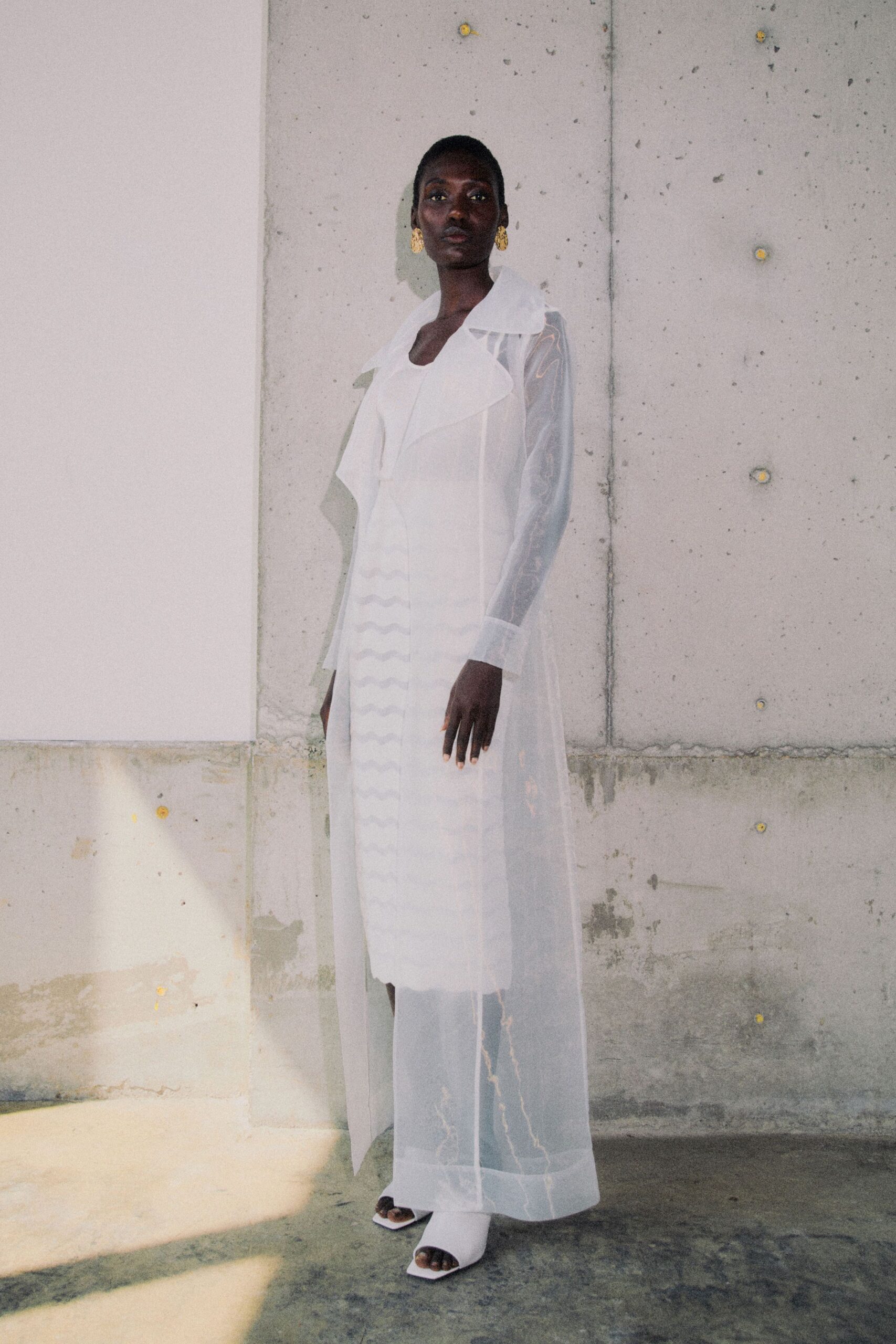 white silk long-sleeve v-neck fitted layered pleated gown