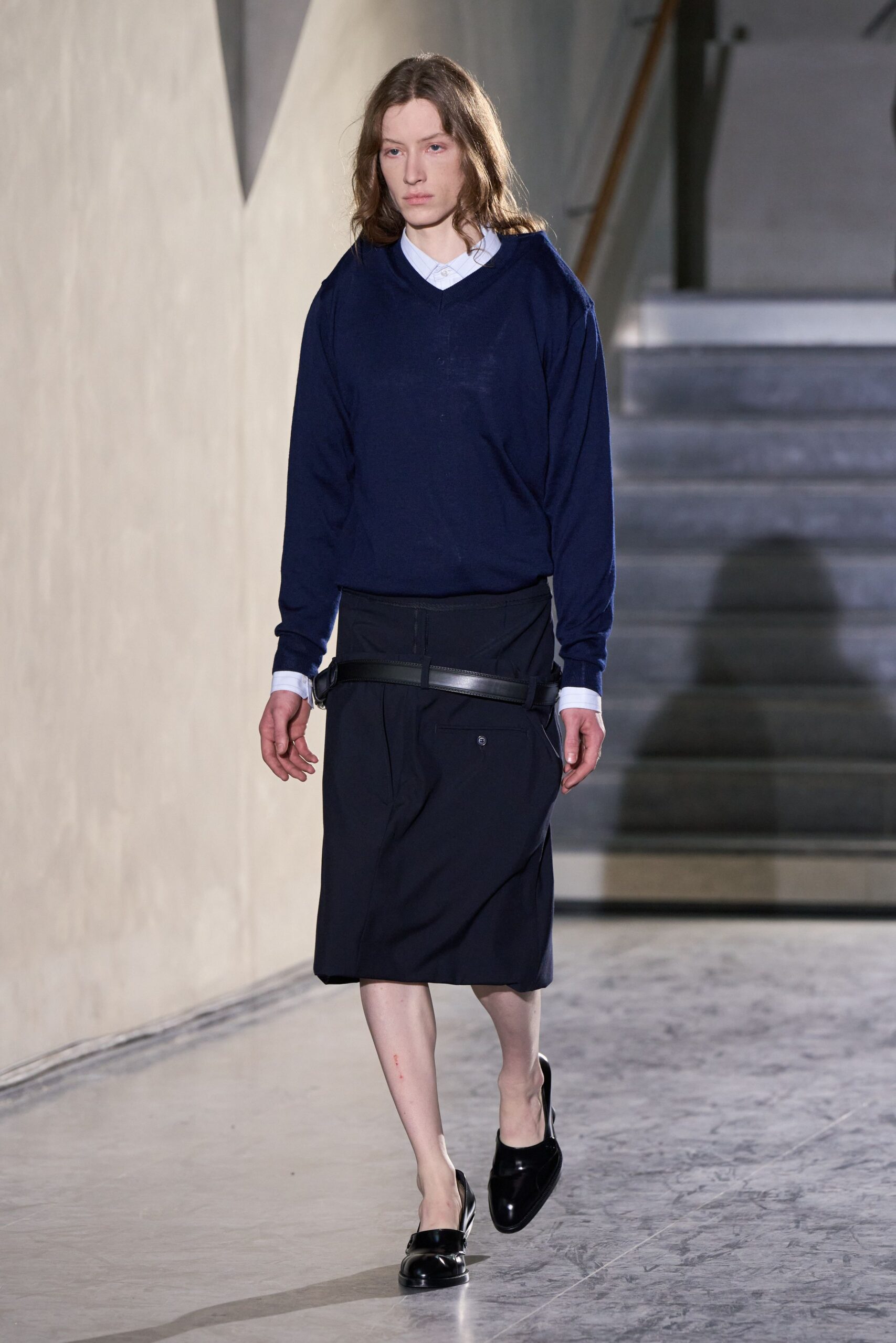 blue relaxed sweater with black skirt