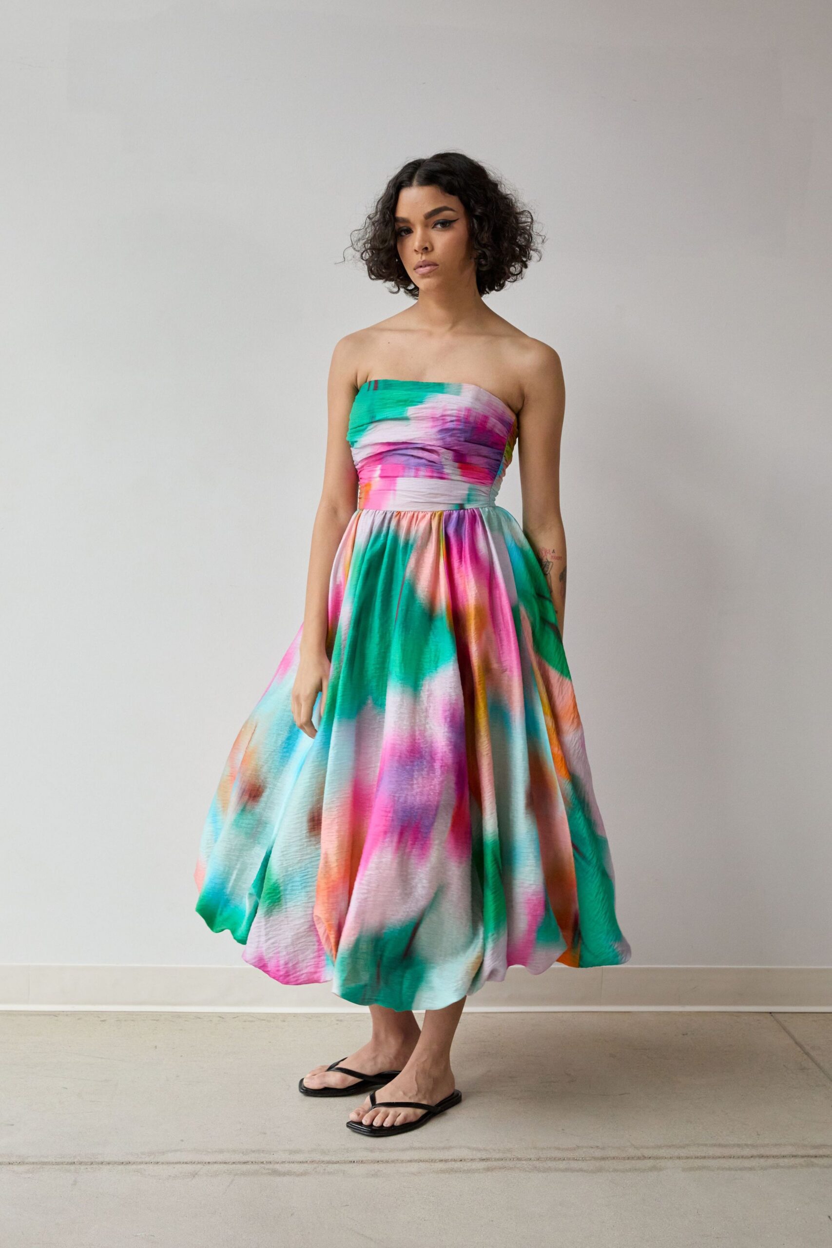 blue silk strapless fitted pleated flowing midi dress