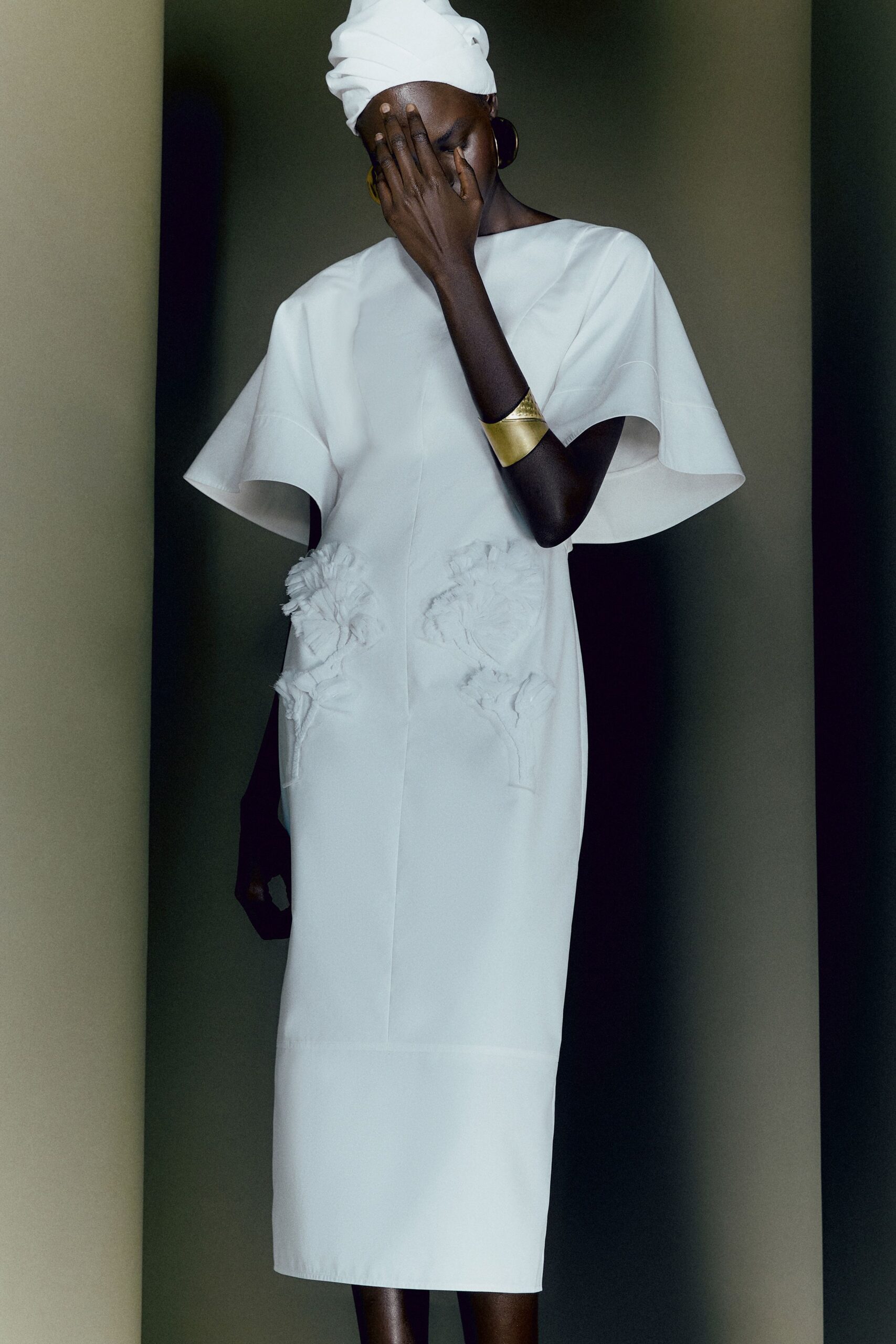 white fitted midi dress with embroidery
