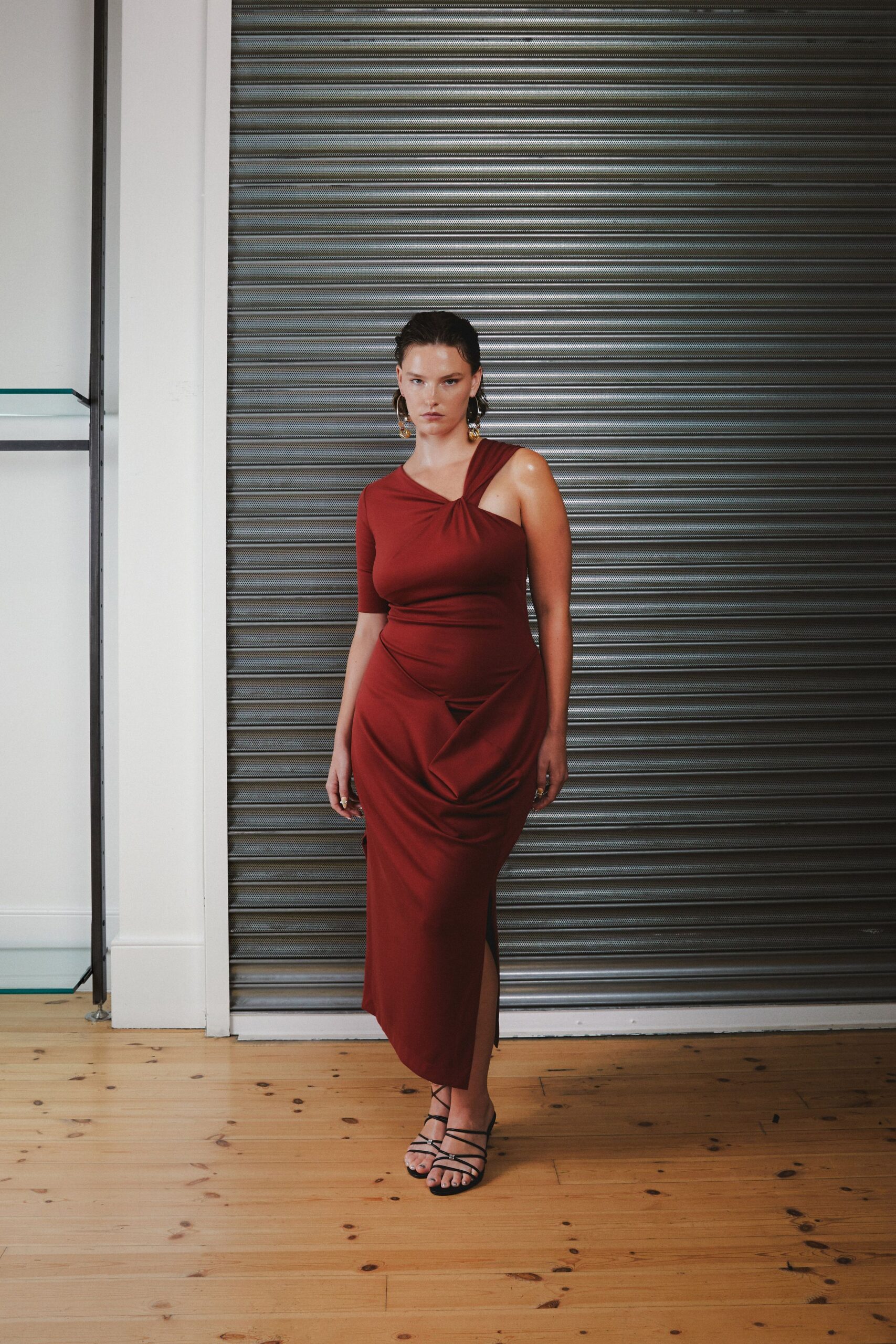 red silk sleeveless asymmetric fitted draped midi gown