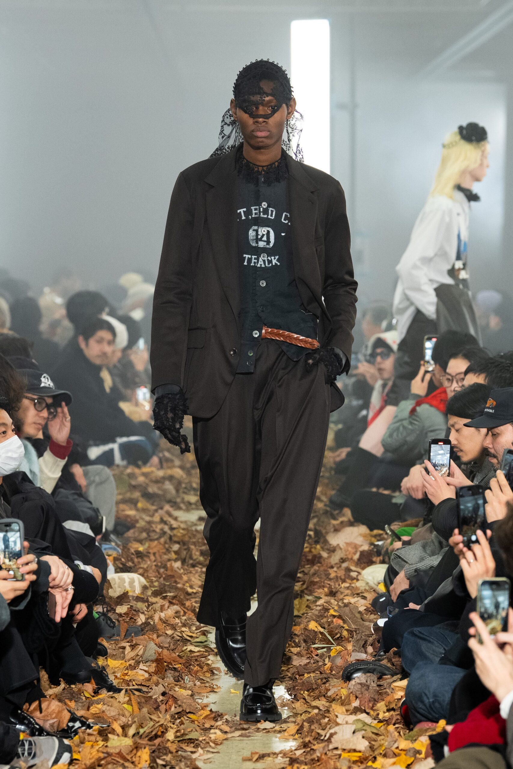 black tailored suit with gloves