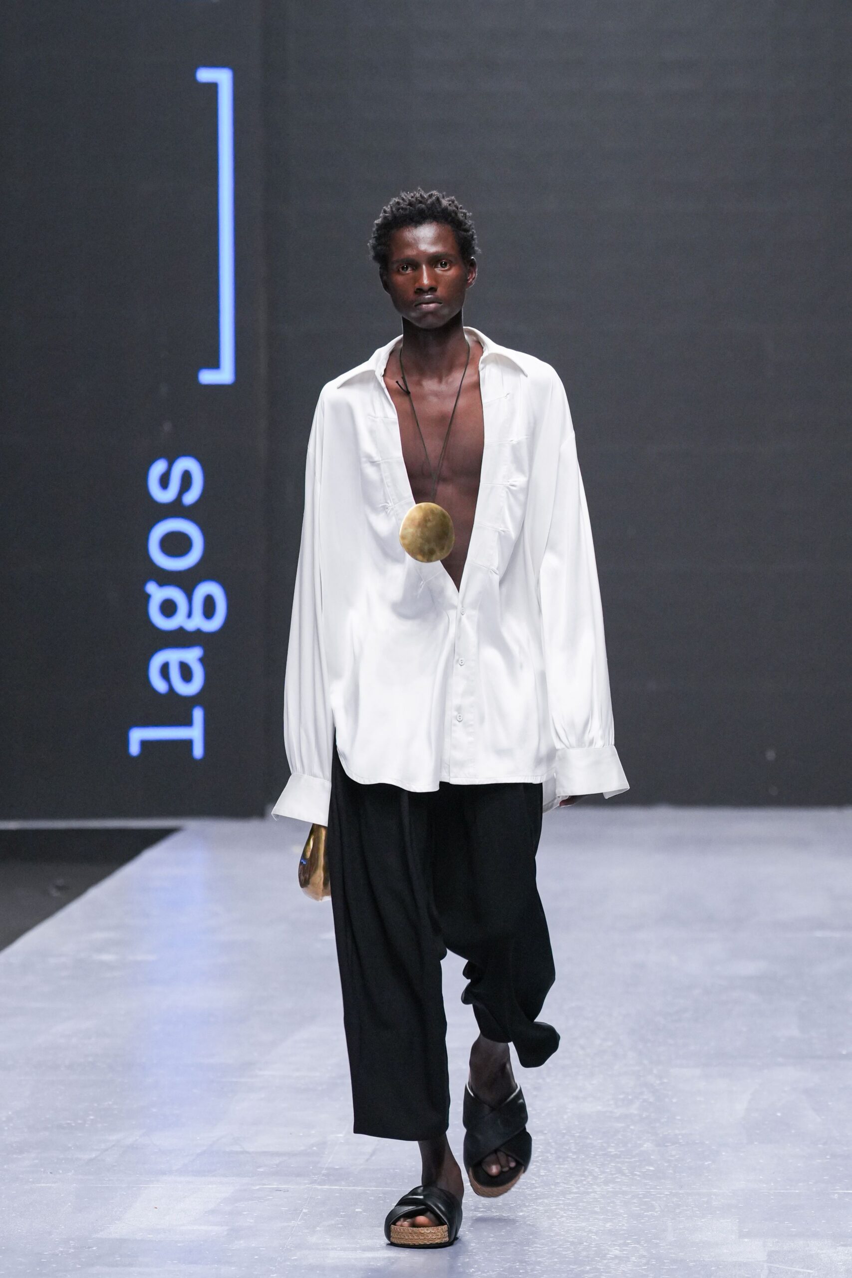 white relaxed shirt with black pants