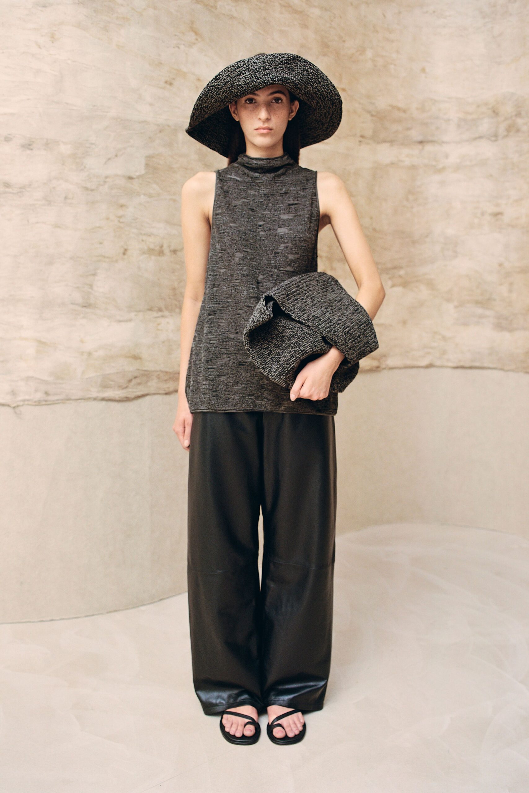 black relaxed top with wide-brimmed hat