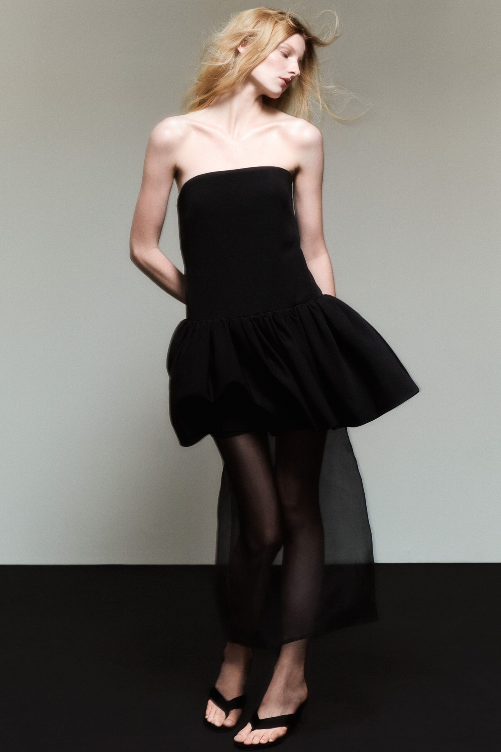 black strapless flared dress