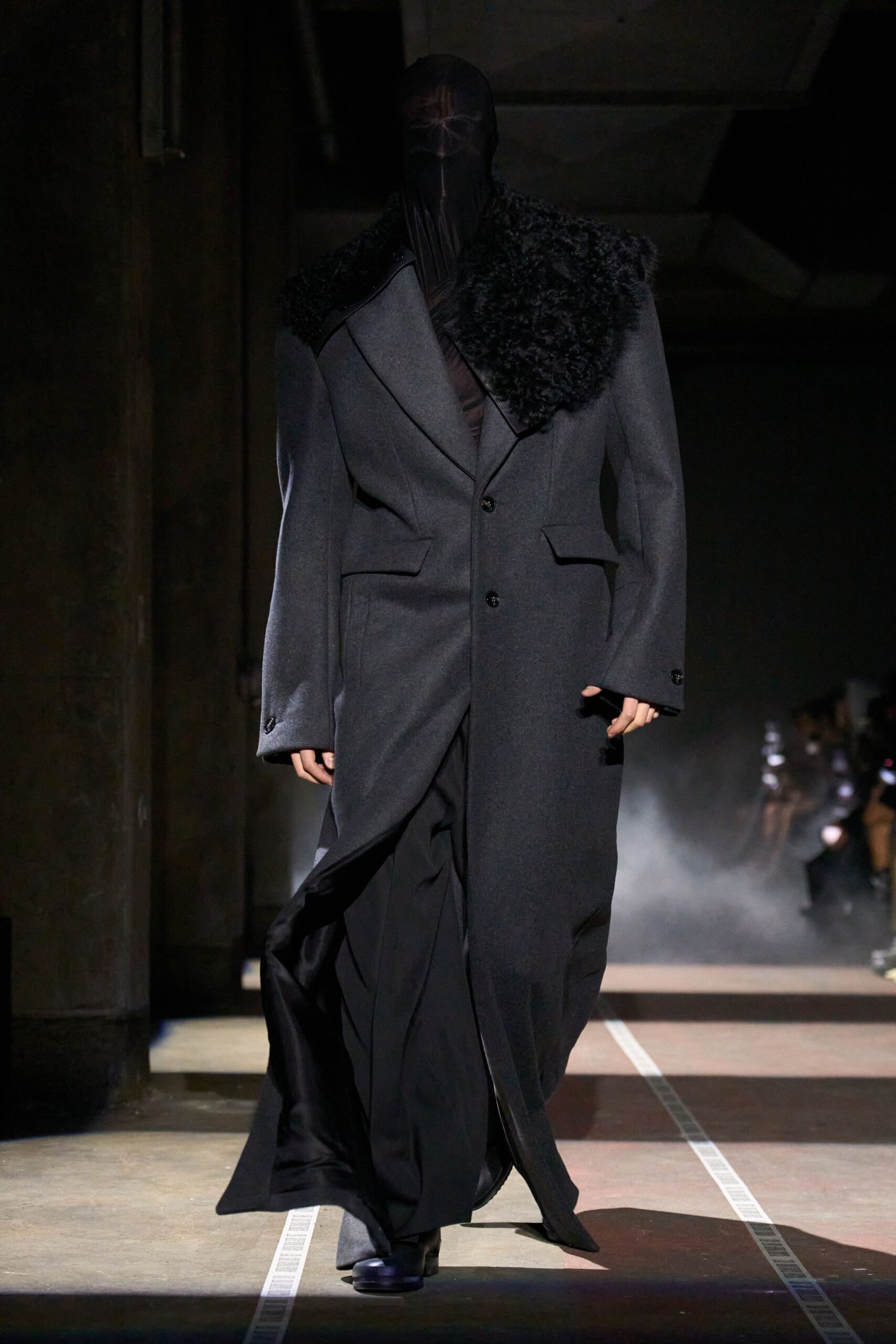 black wool coat with fur trim and black silk dress