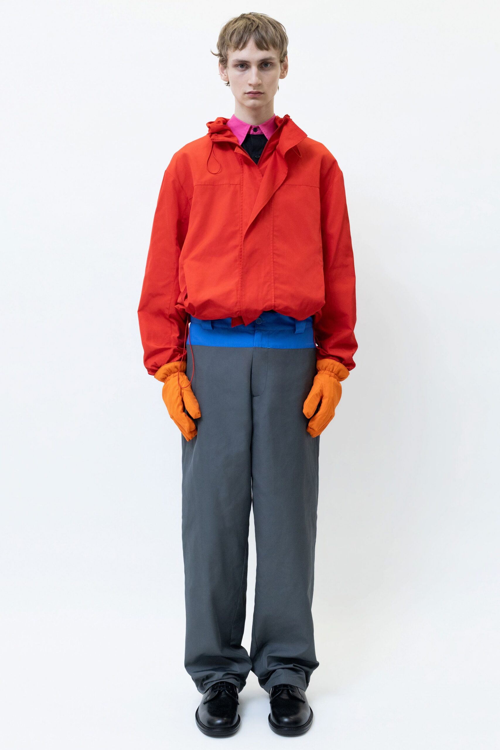 red jacket pink shirt gray pants