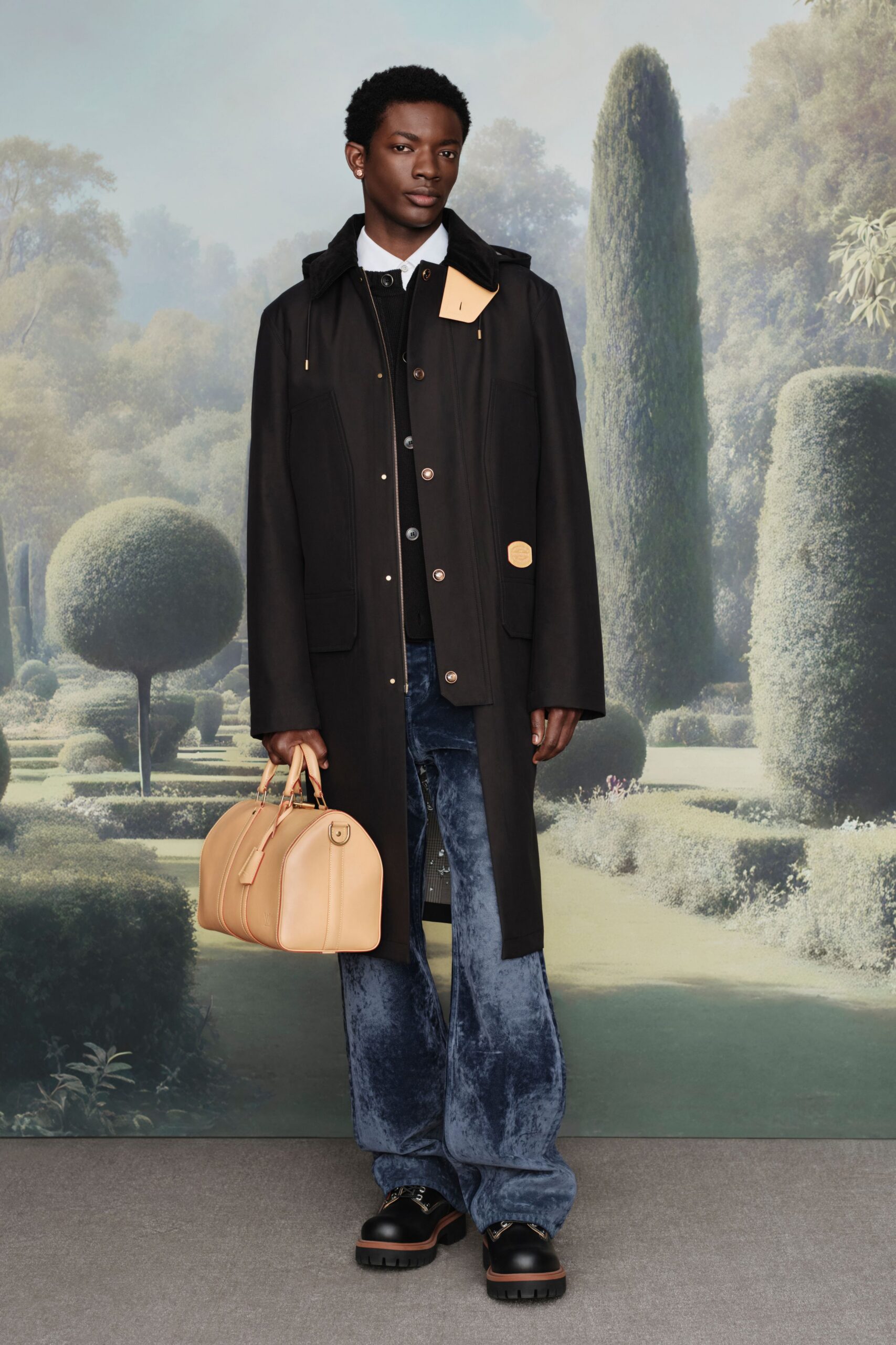 black coat with beige bag