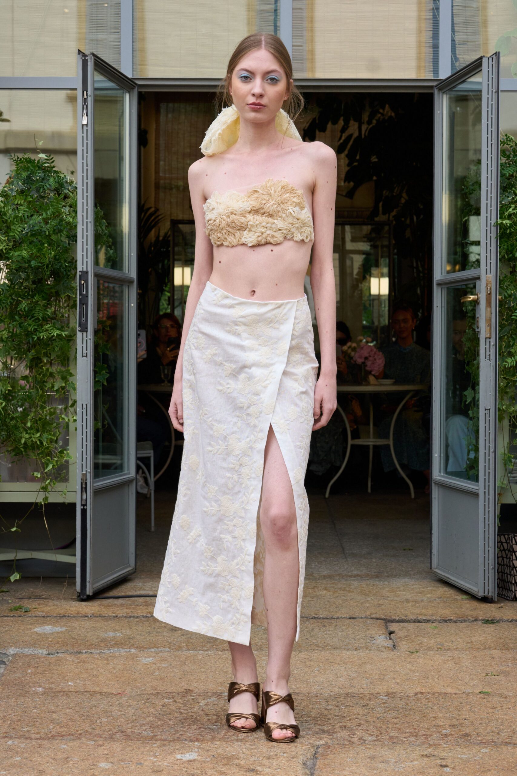 white silk slit fitted high-waisted pleated skirt