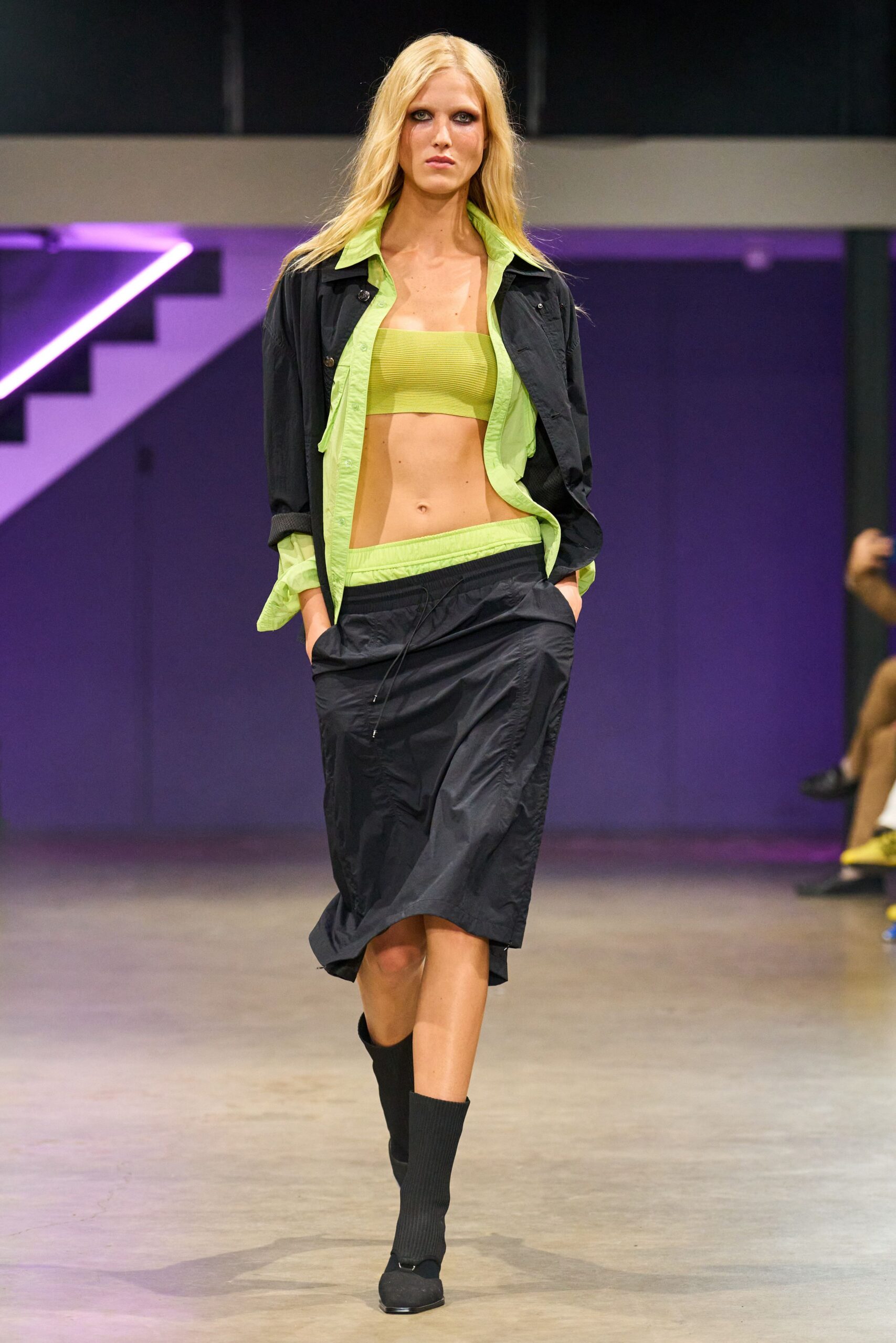 black jacket green top midi skirt