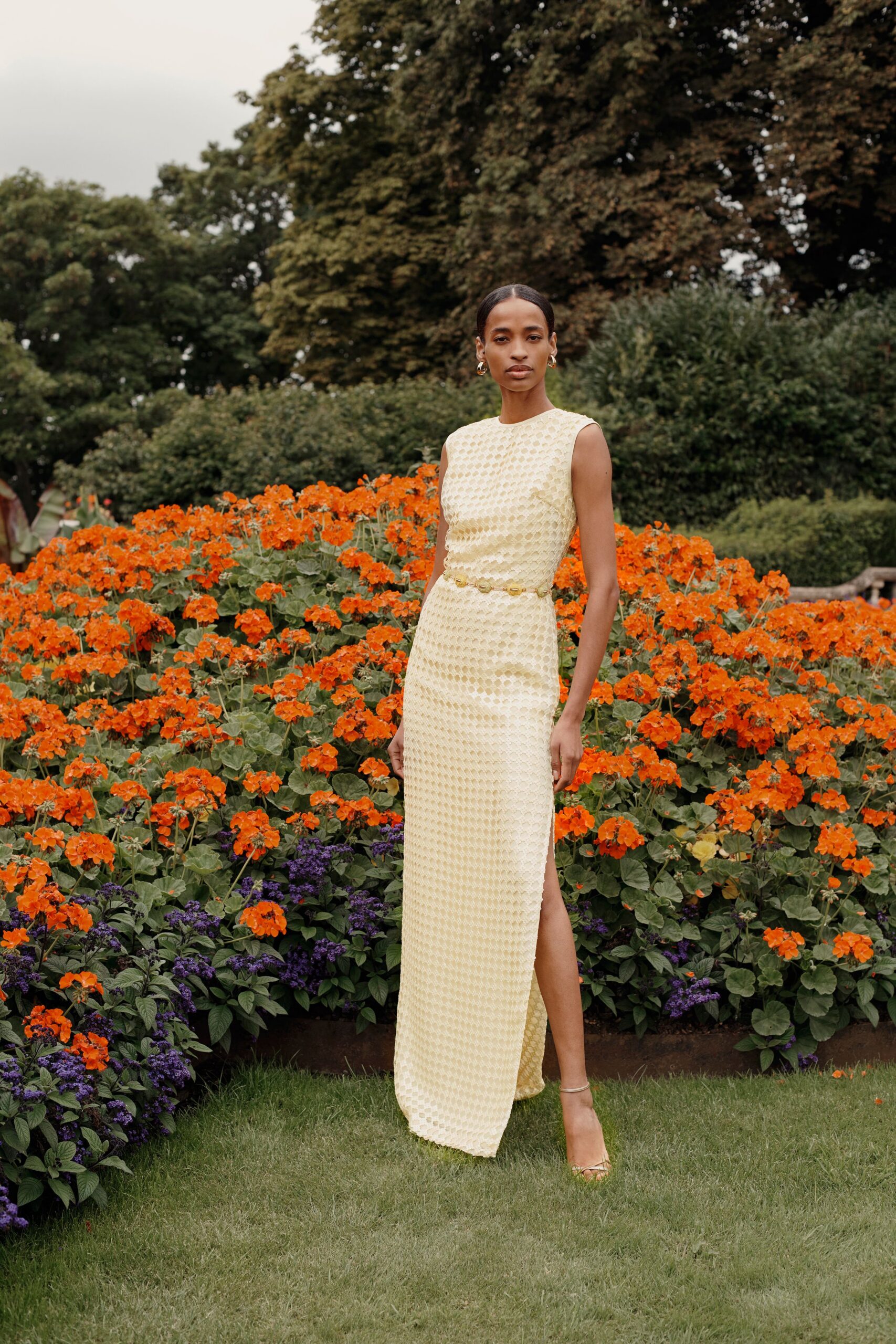 yellow silk sleeveless high-neck fitted pleated maxi gown
