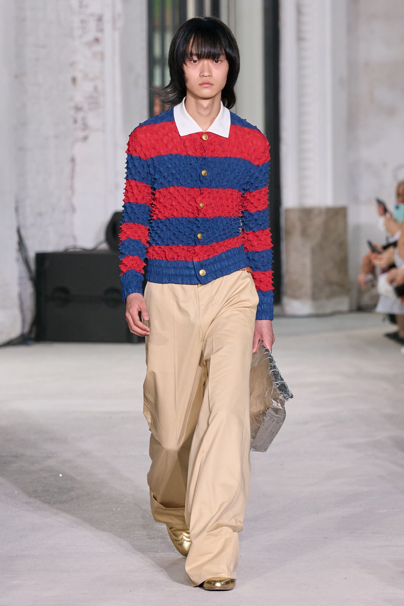red and blue striped sweater with beige pants