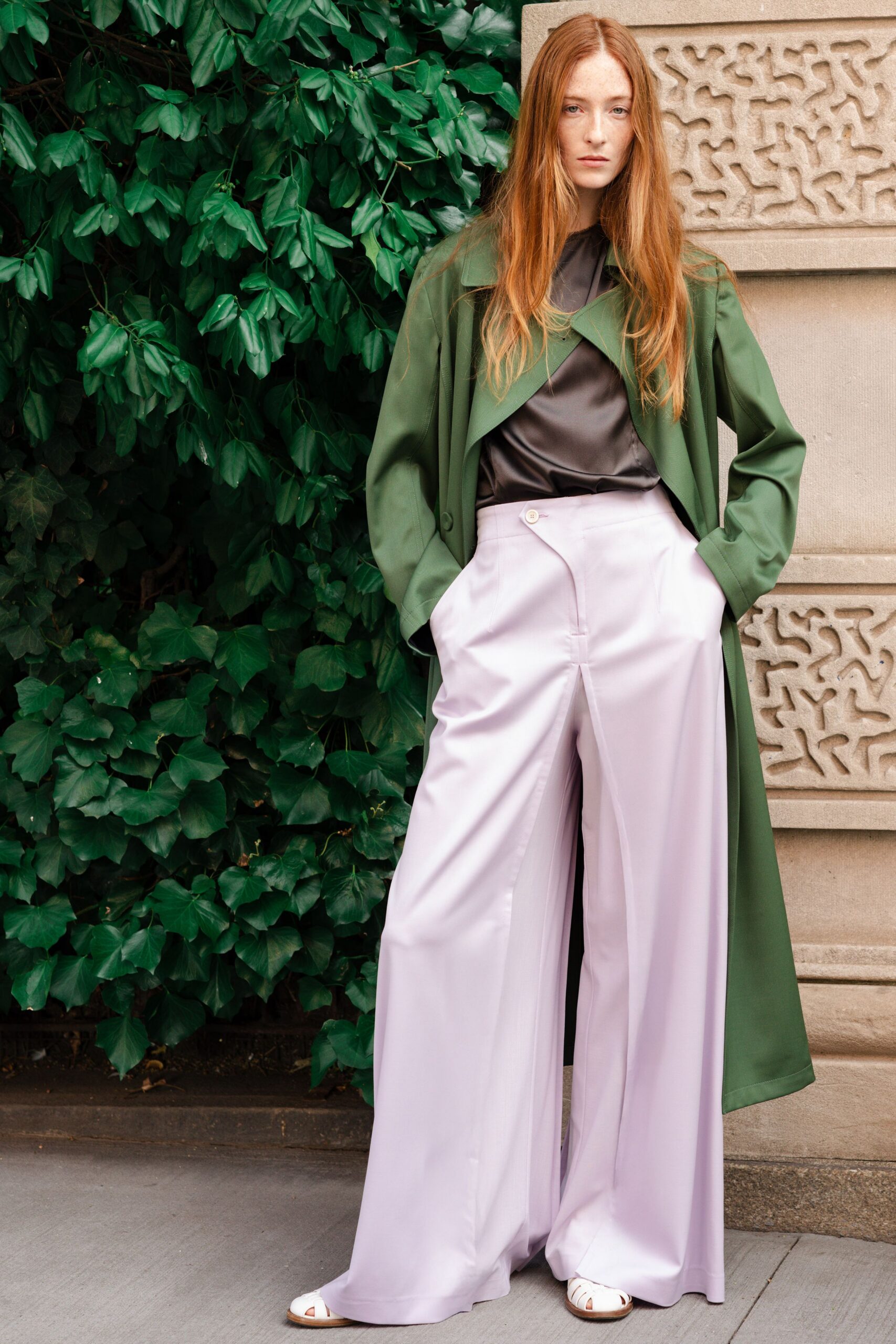 green coat black shirt lavender pants