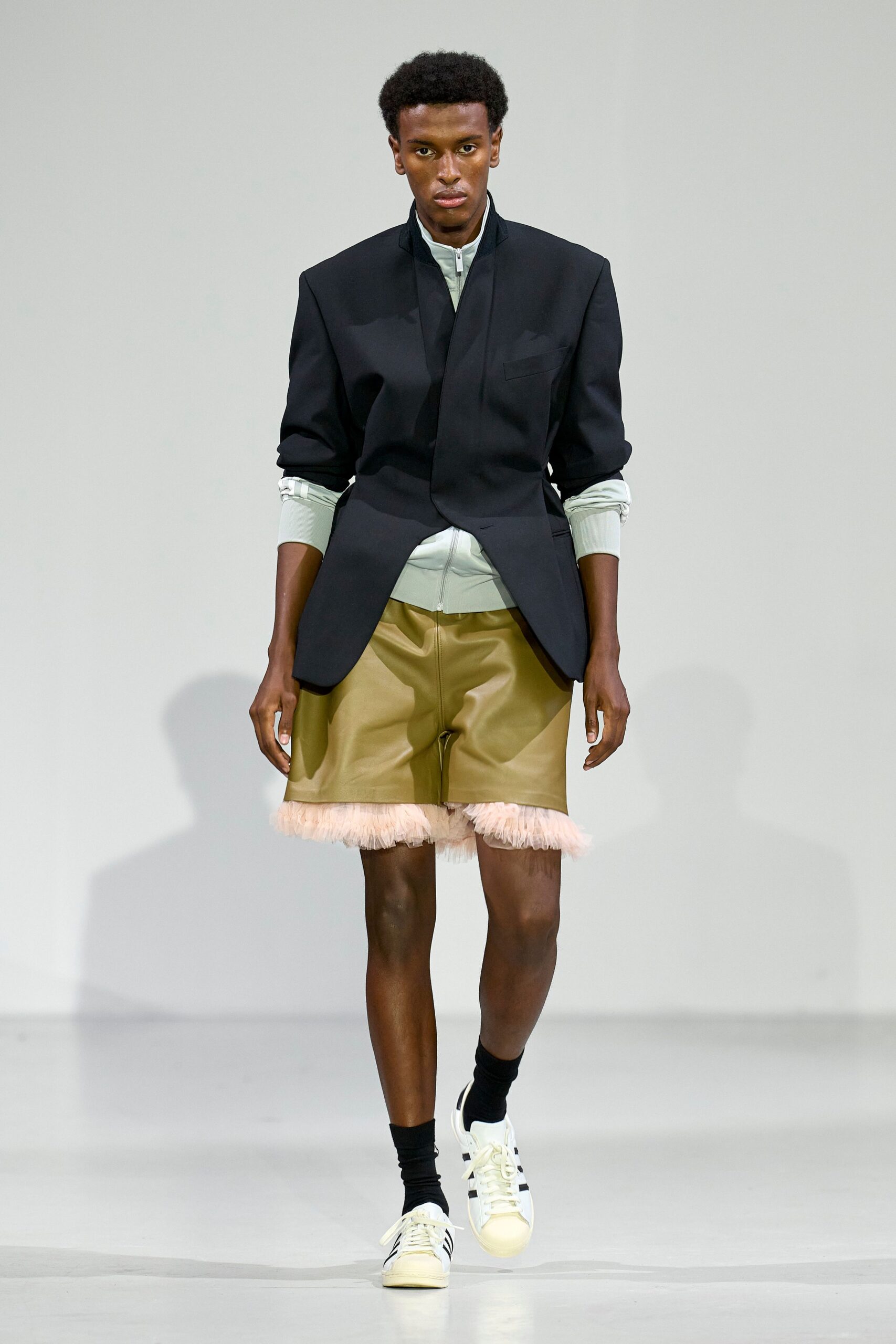 black blazer with beige shorts