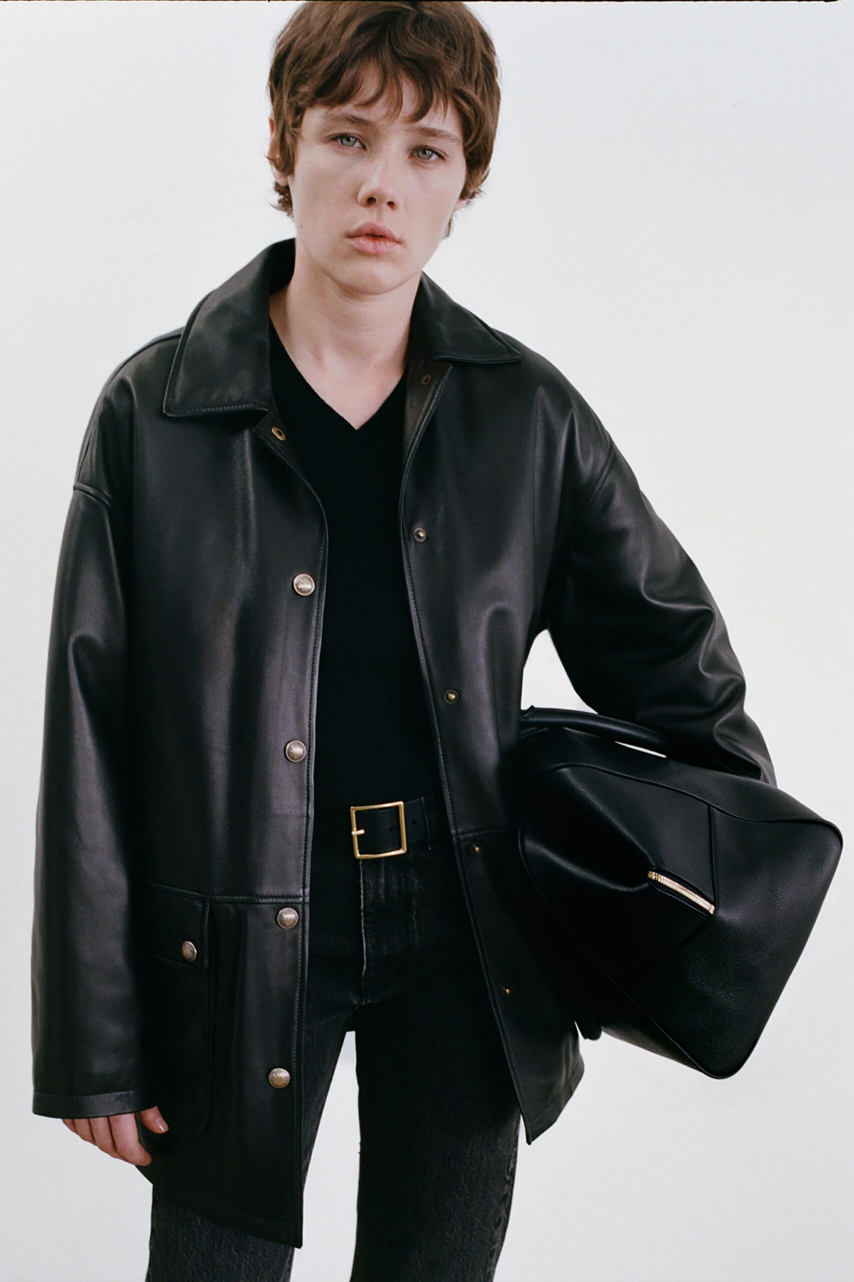 black leather long-sleeve collared relaxed buttoned jacket