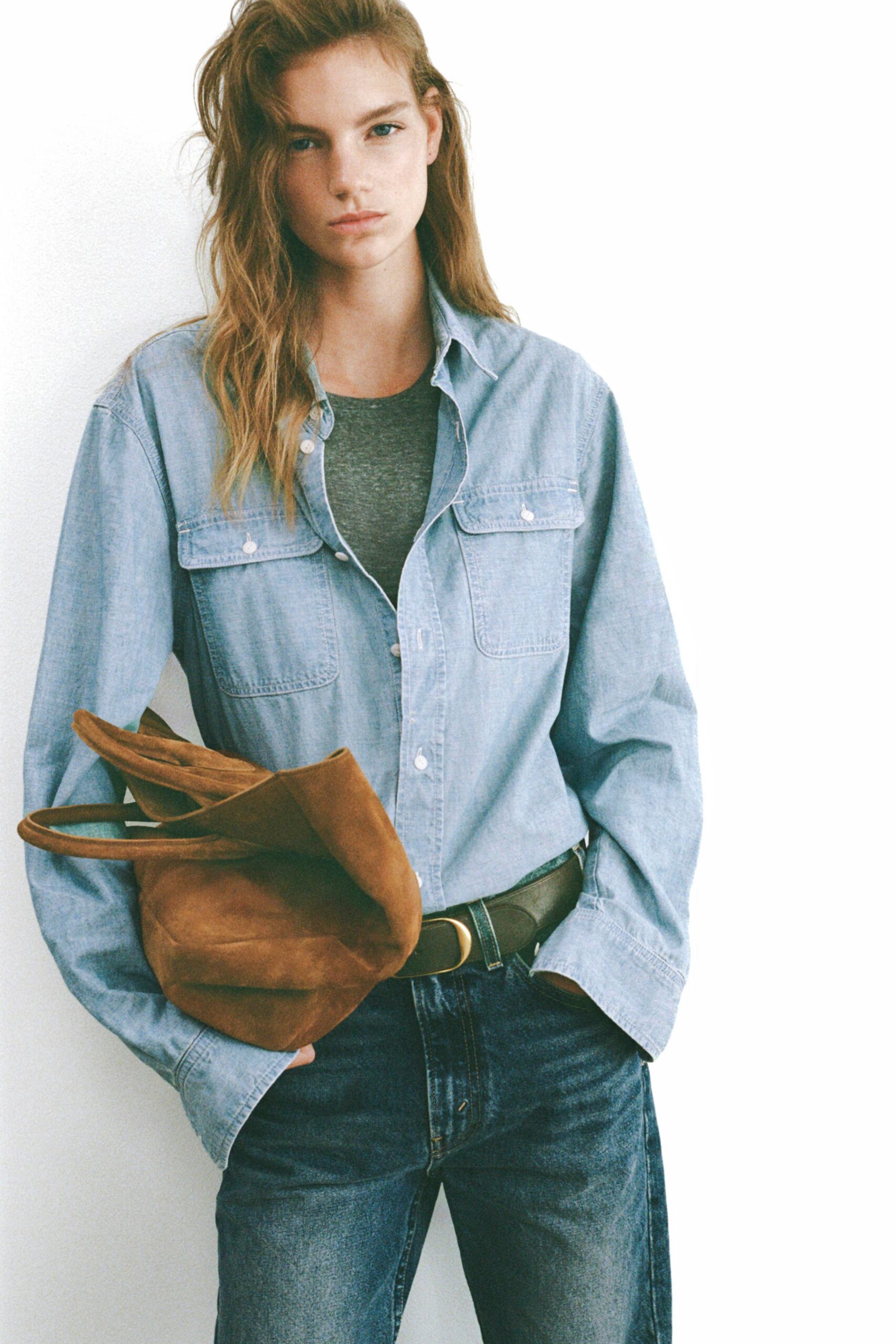 blue shirt gray tank-top jeans