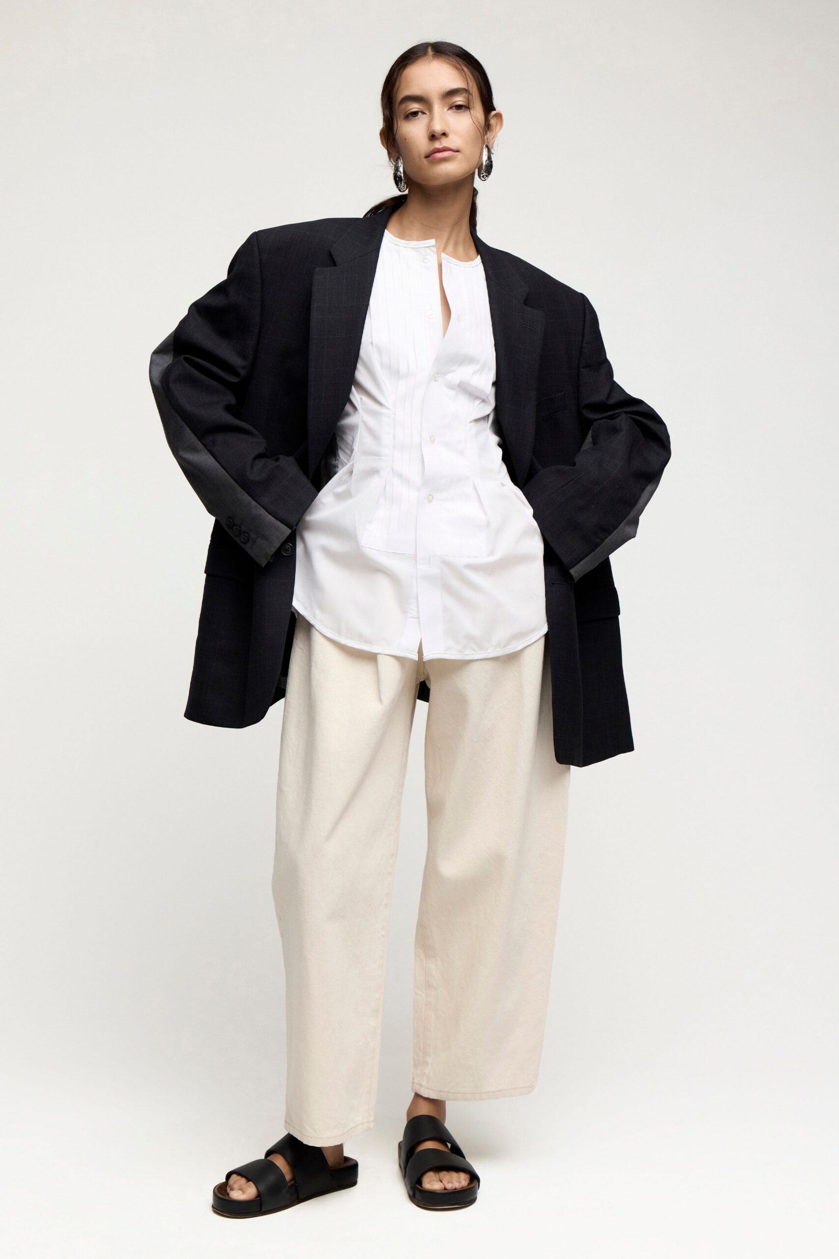 black blazer white shirt beige pants