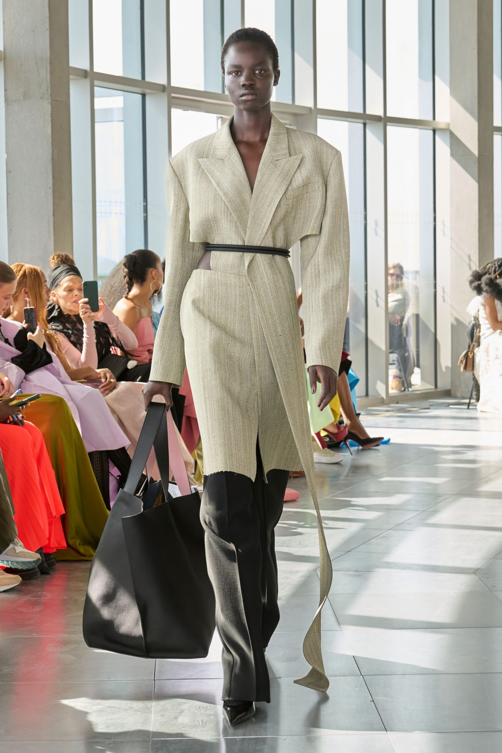 beige fitted blazer with black pants
