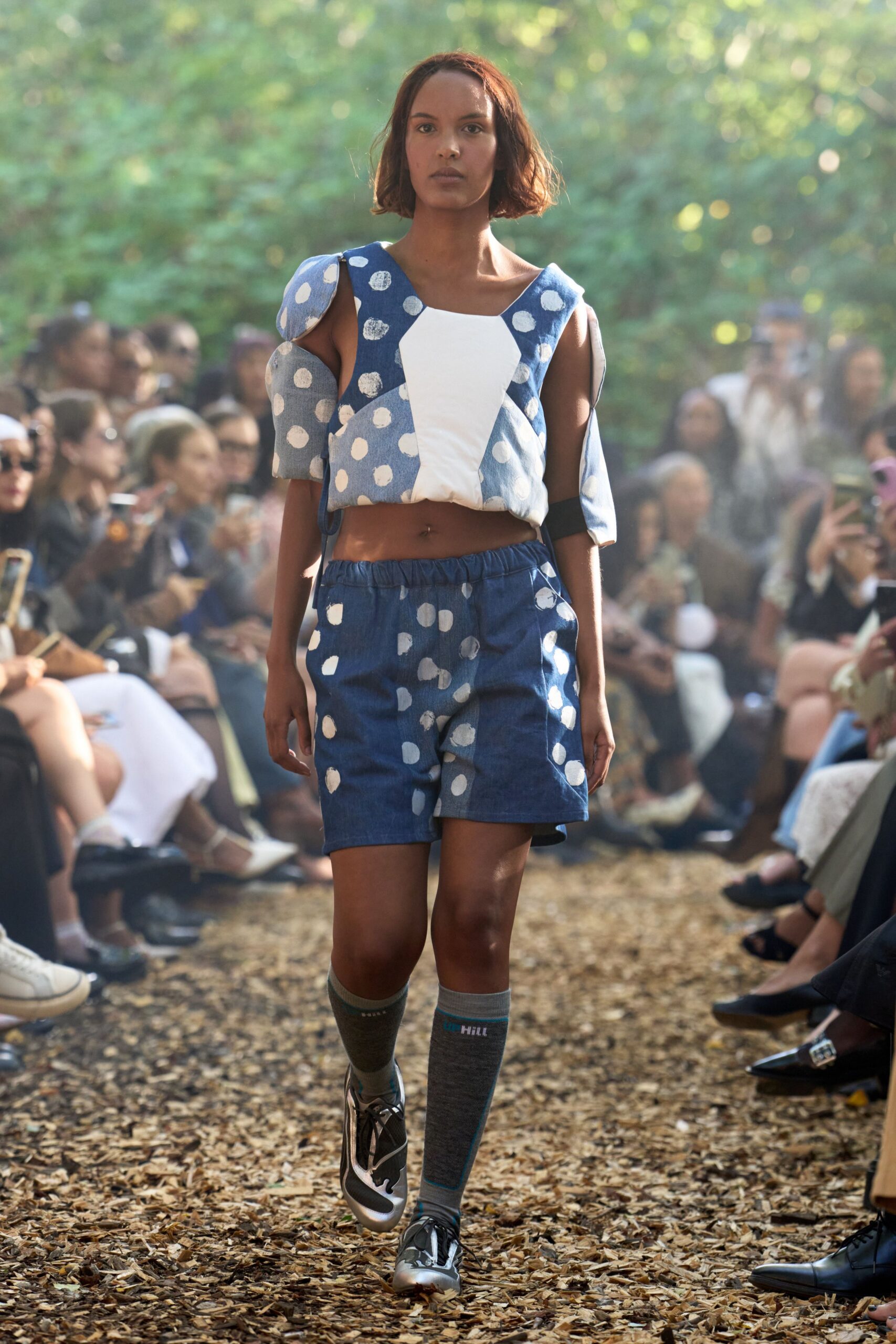 blue polka-dot top and denim shorts