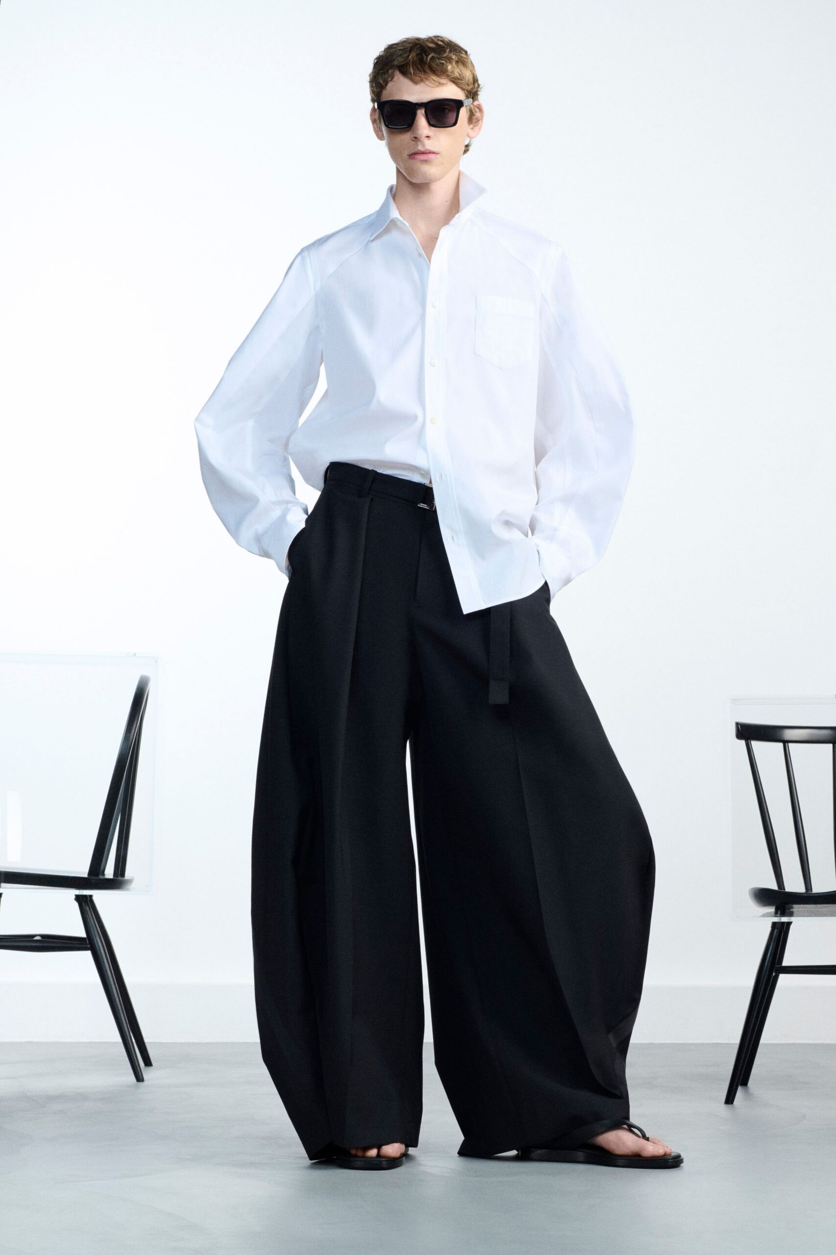 white relaxed shirt black wide-leg pants