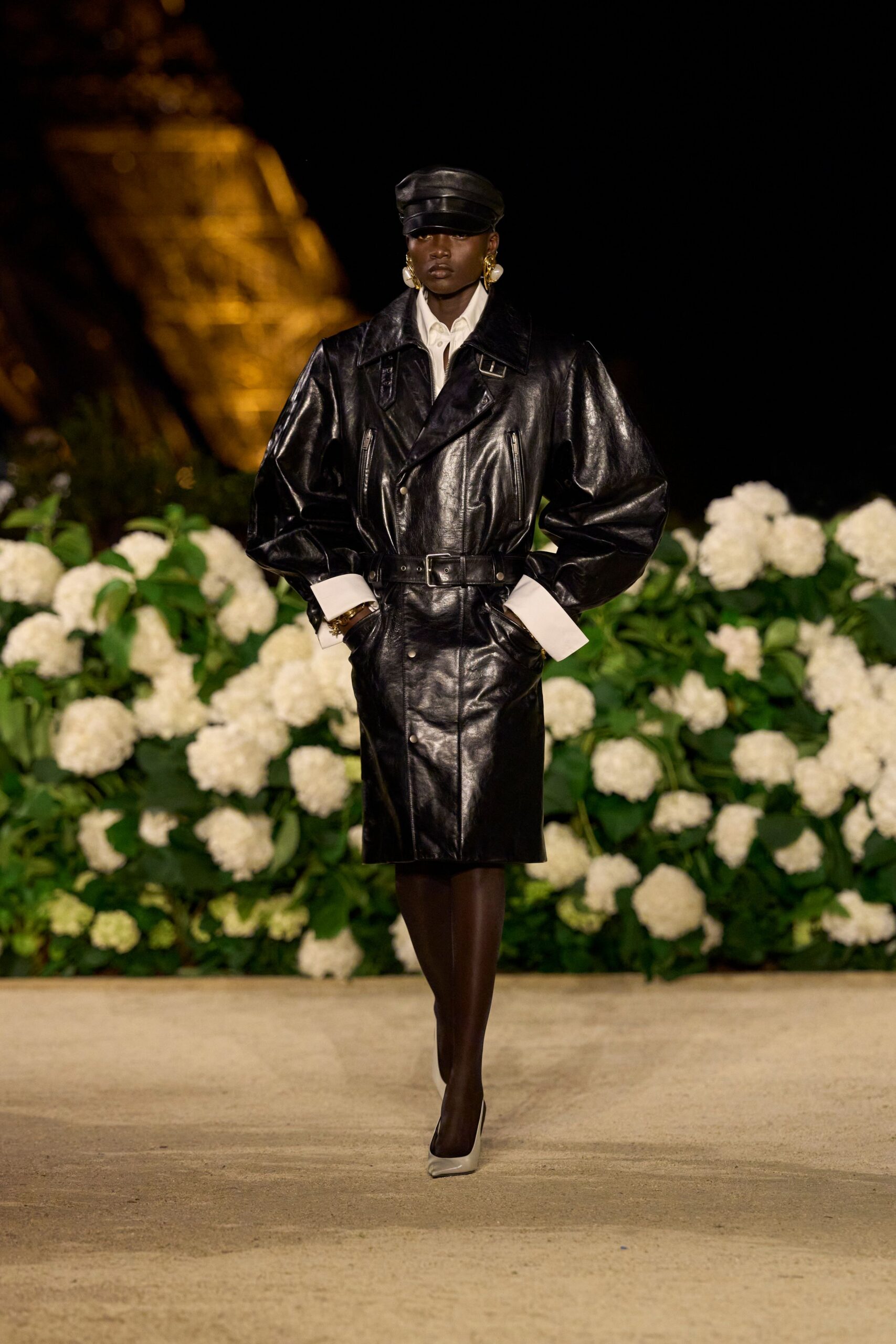 black leather long-sleeve collared oversized buttoned zippered coat