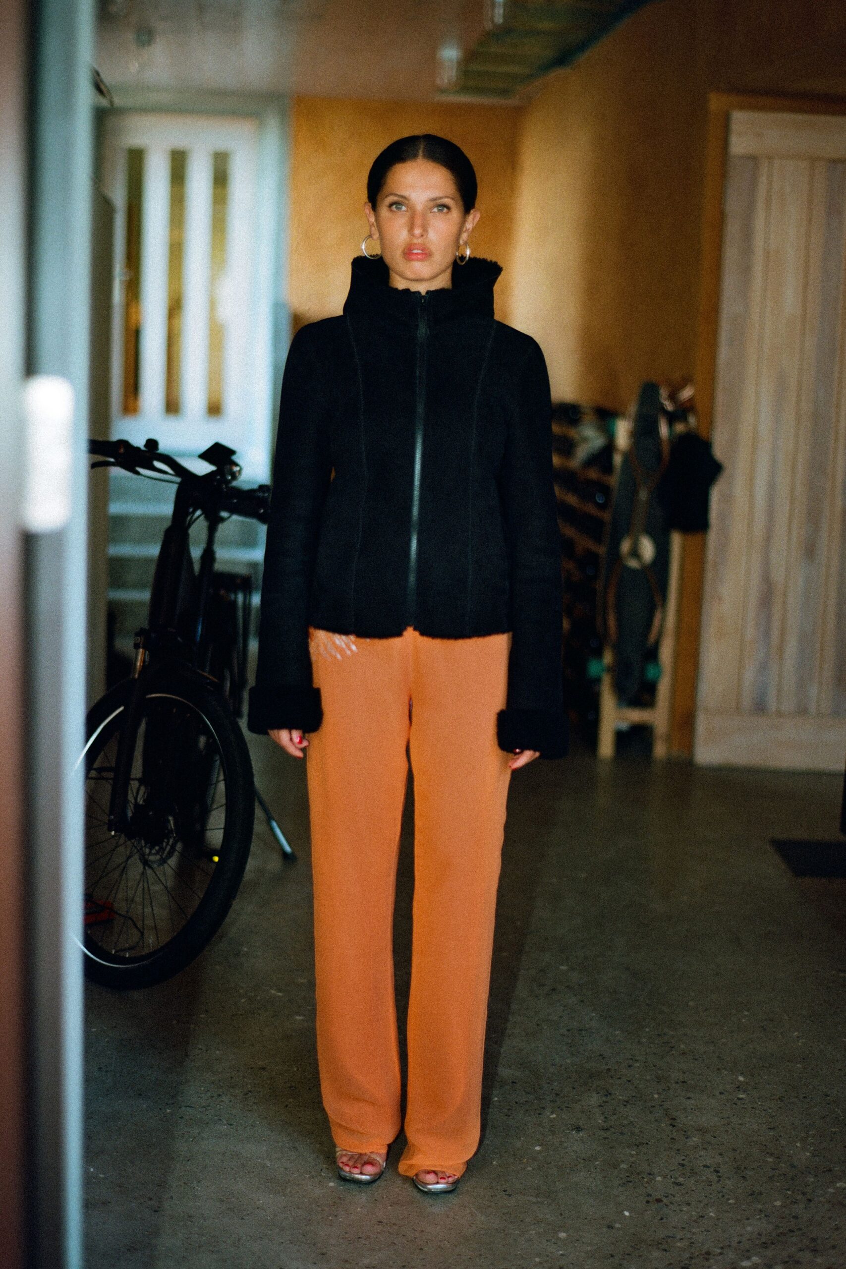 black fitted jacket orange pants