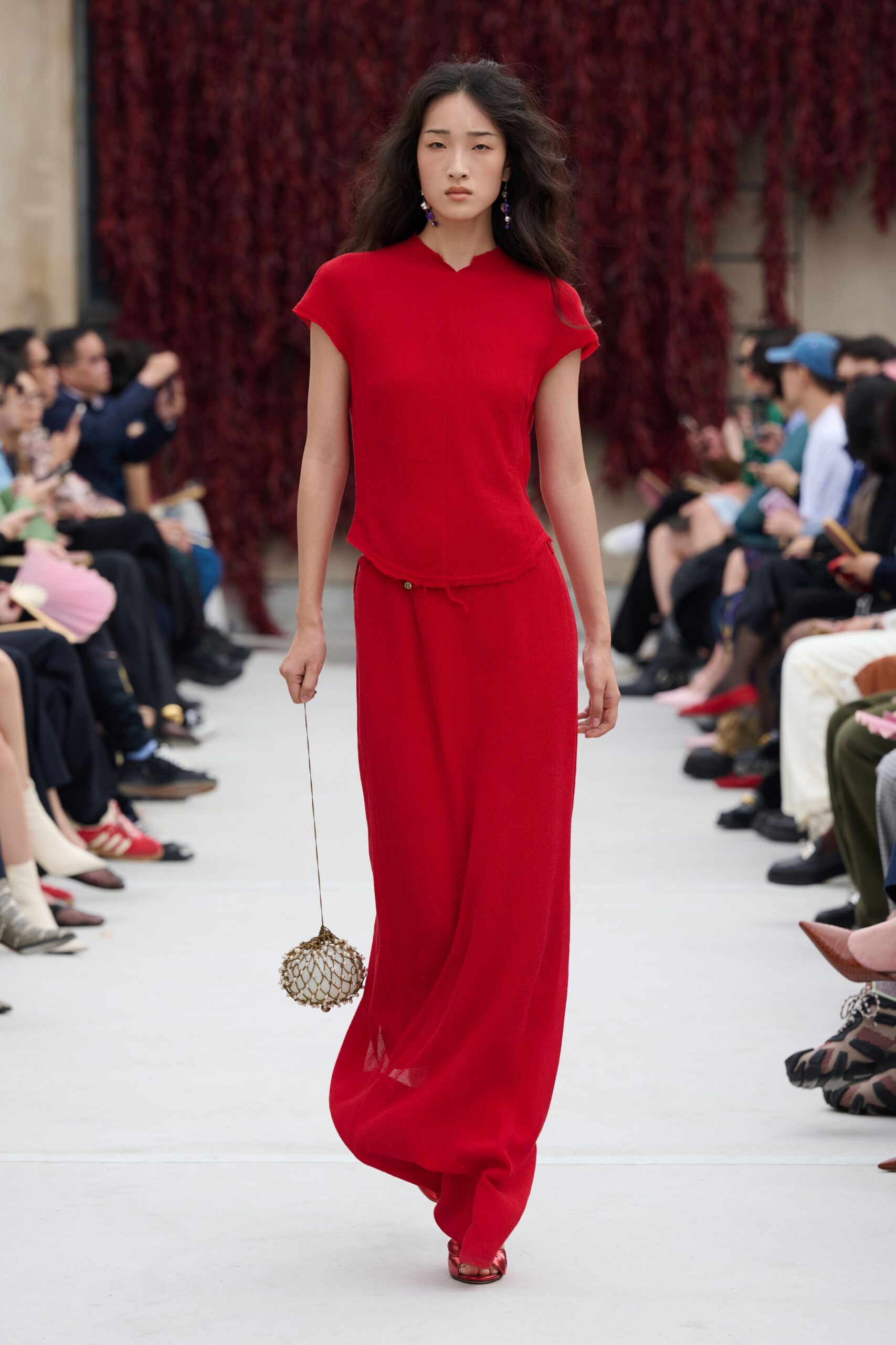 red silk short-sleeve high-neck fitted draped flowing top