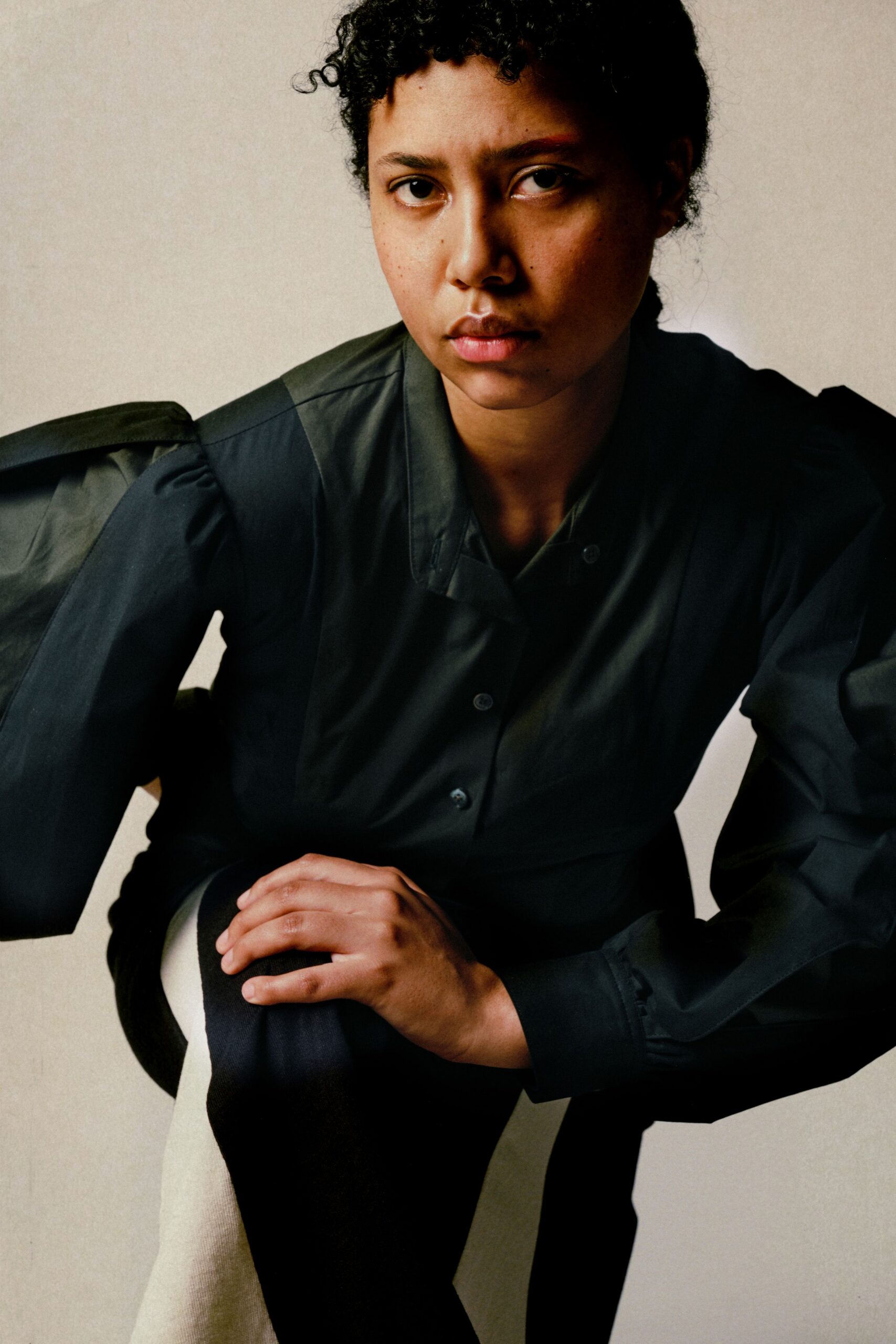 black shirt with color-blocked pants