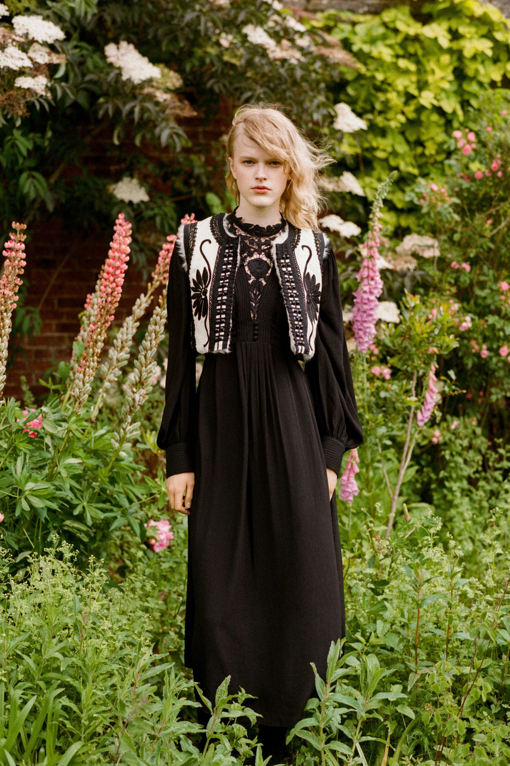 black maxi dress with embroidered vest