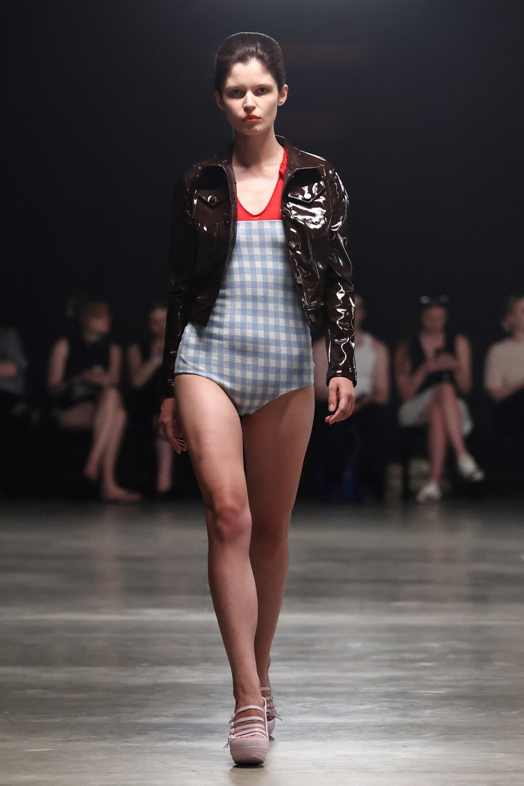 brown vinyl jacket and blue checked swimsuit