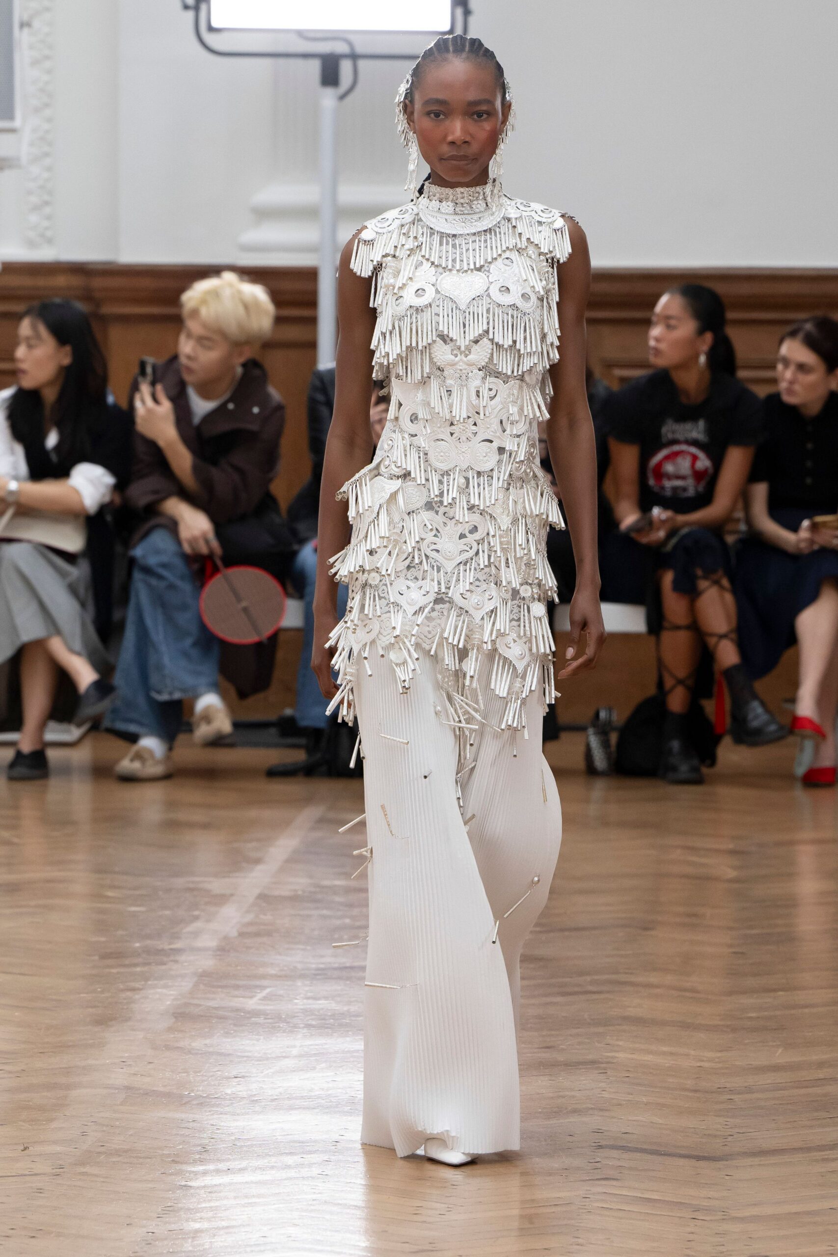 white fringed sleeveless gown