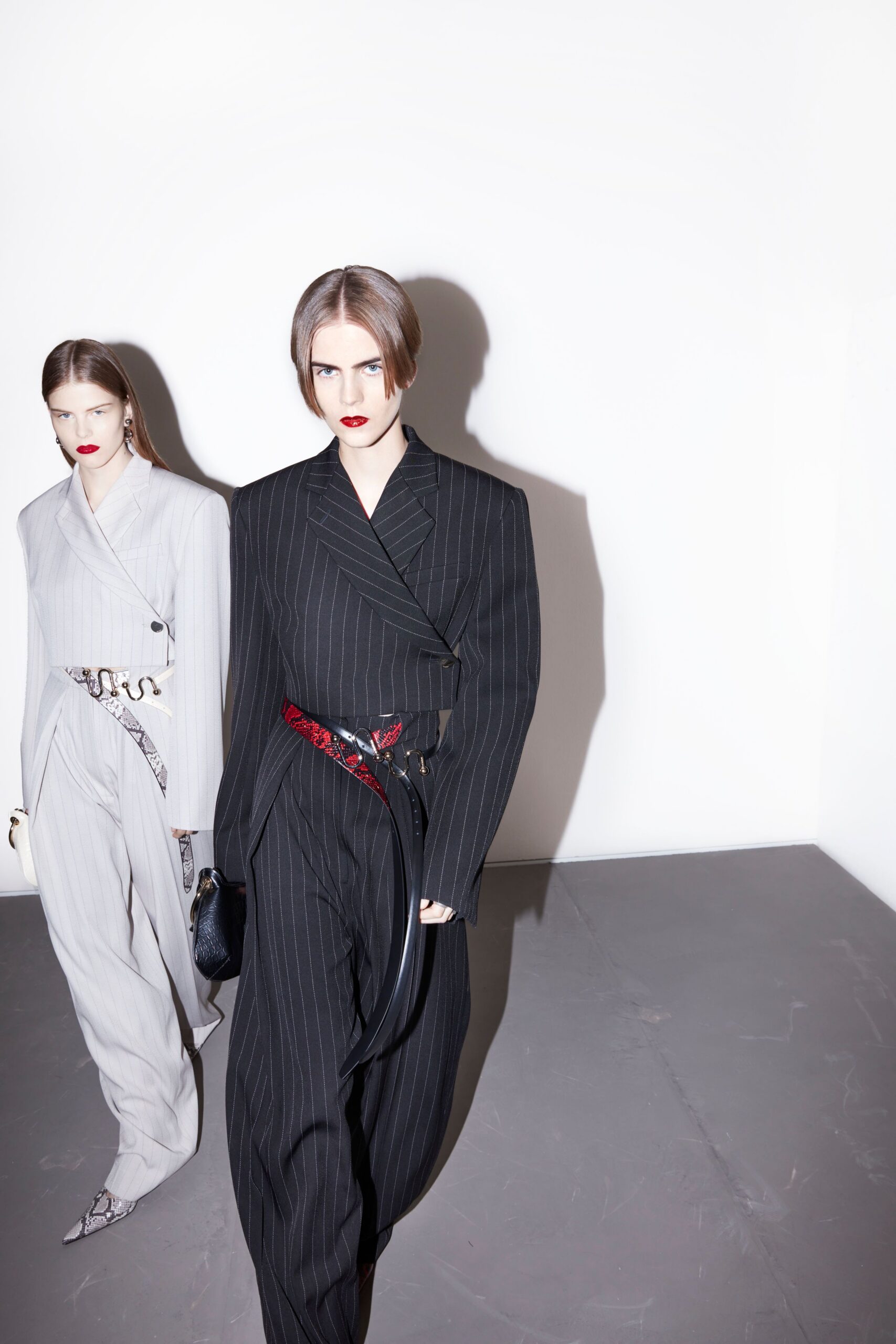 black long-sleeve collared tailored striped belted suit