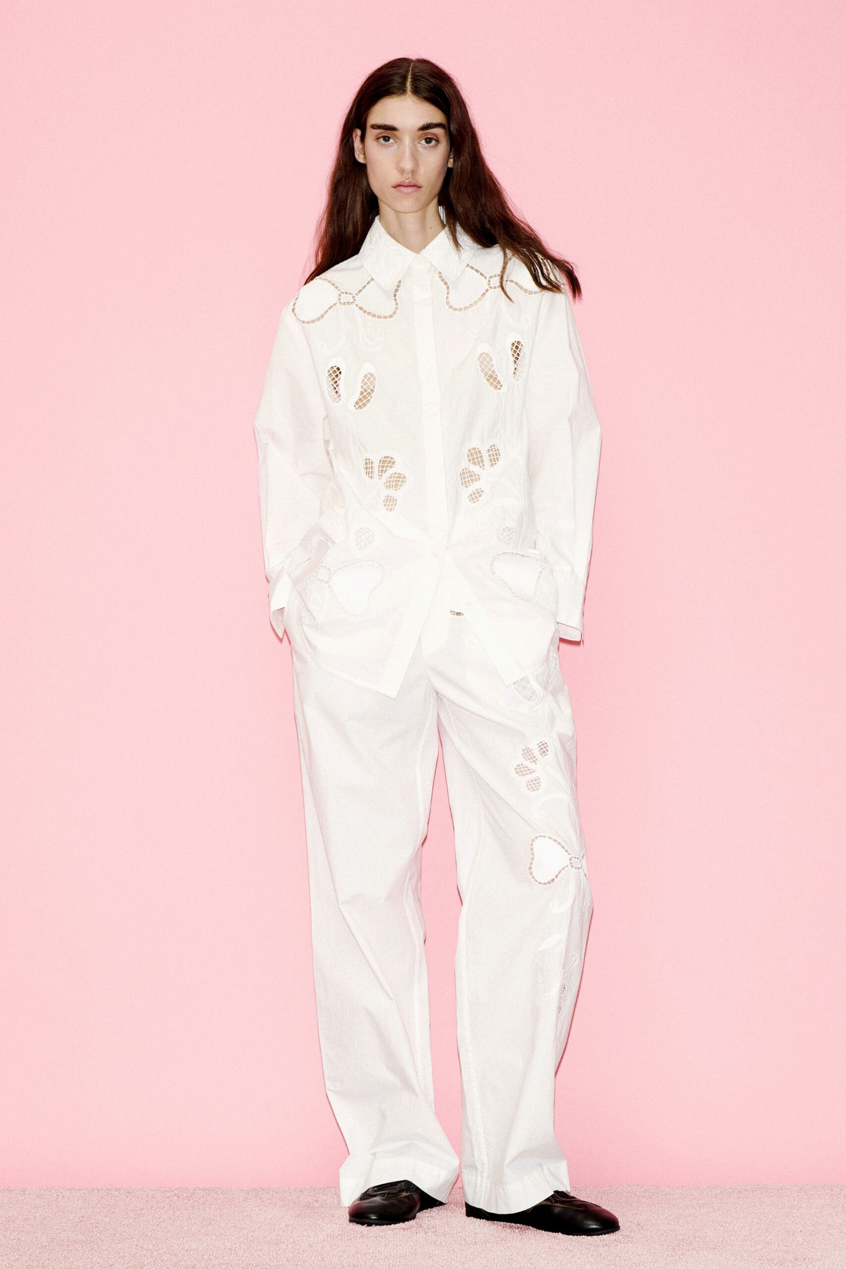 white embroidered shirt and pants