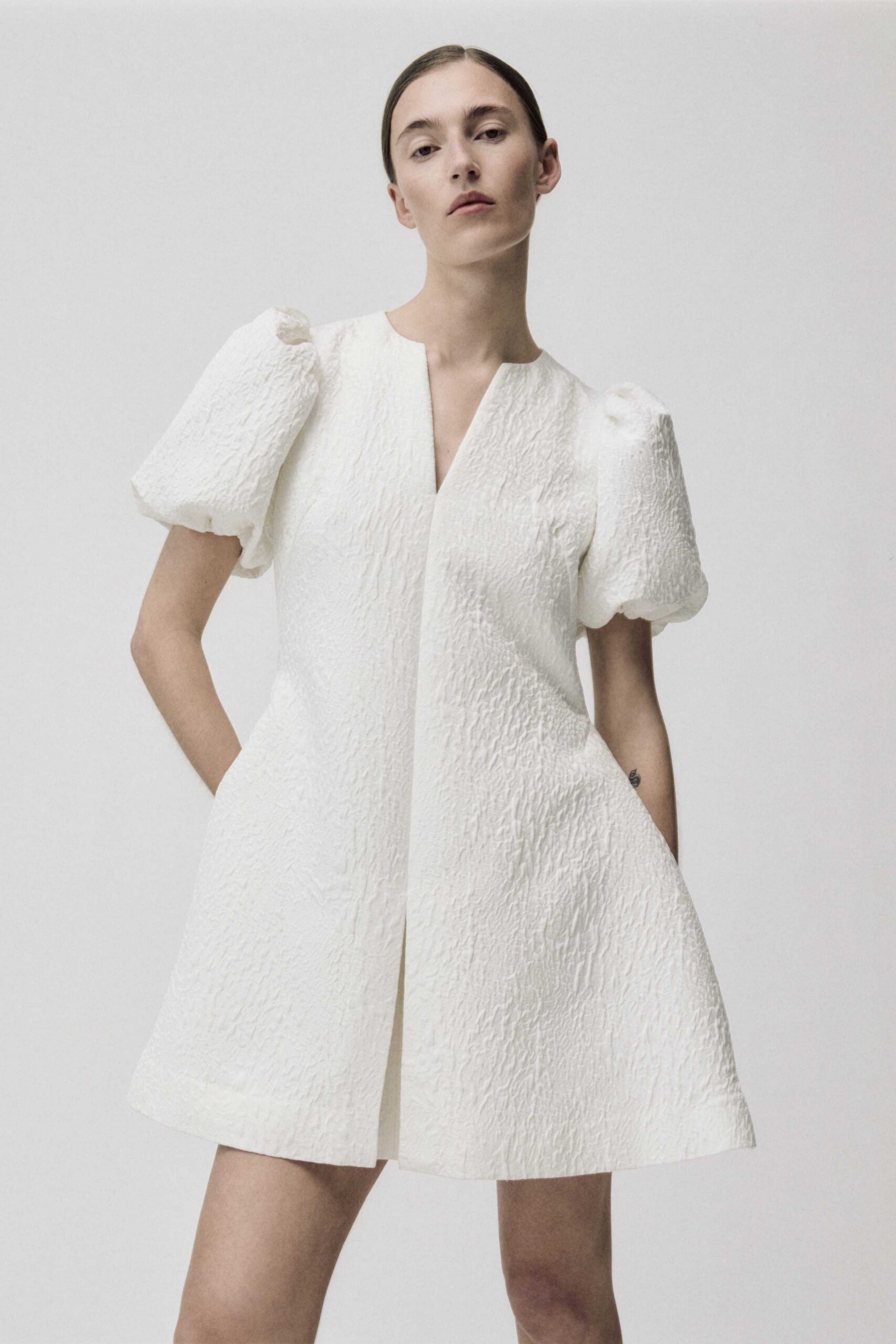 white pleated mini dress