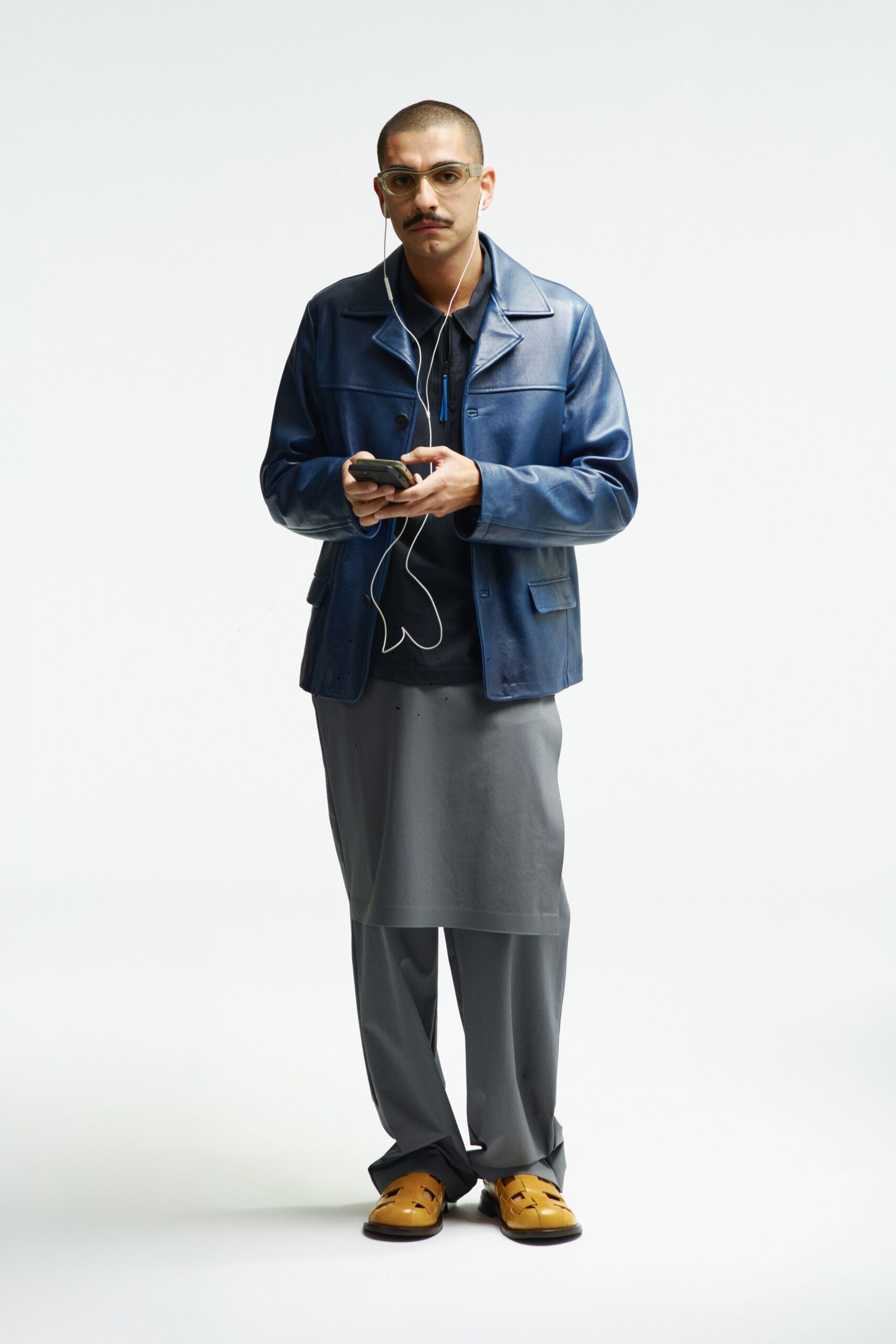 blue leather jacket with gray skirt