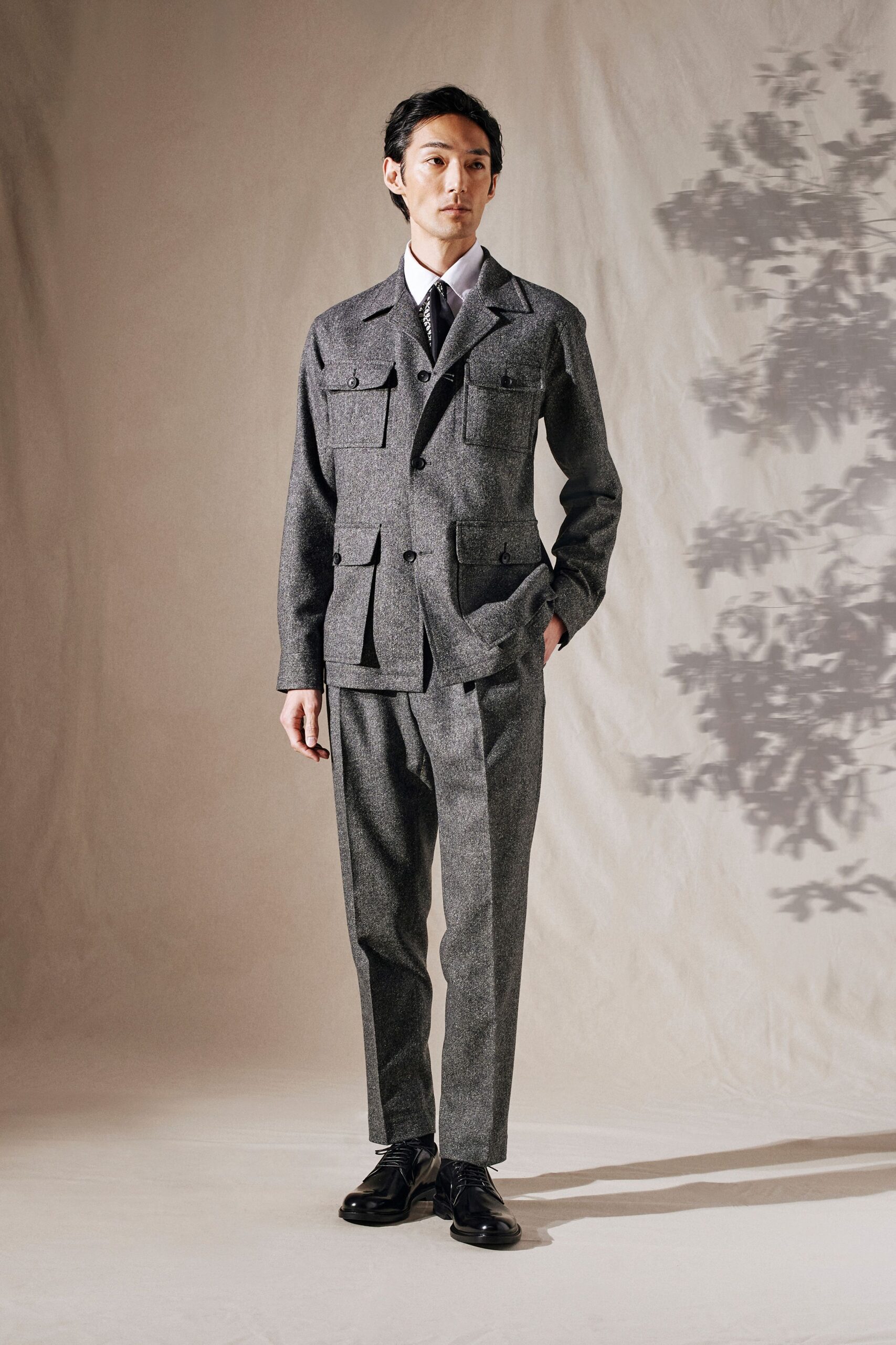 gray tailored suit with black shoes