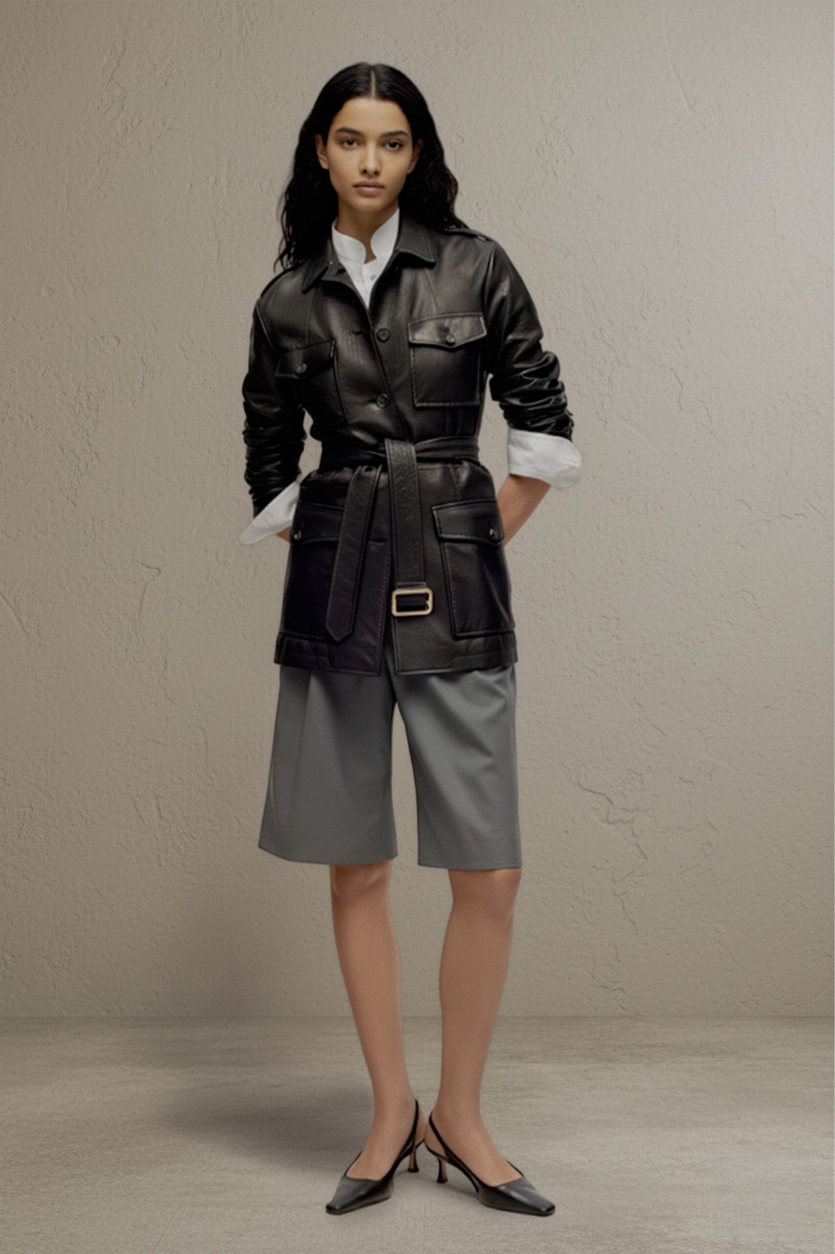 black leather long-sleeve collared fitted buttoned belted jacket