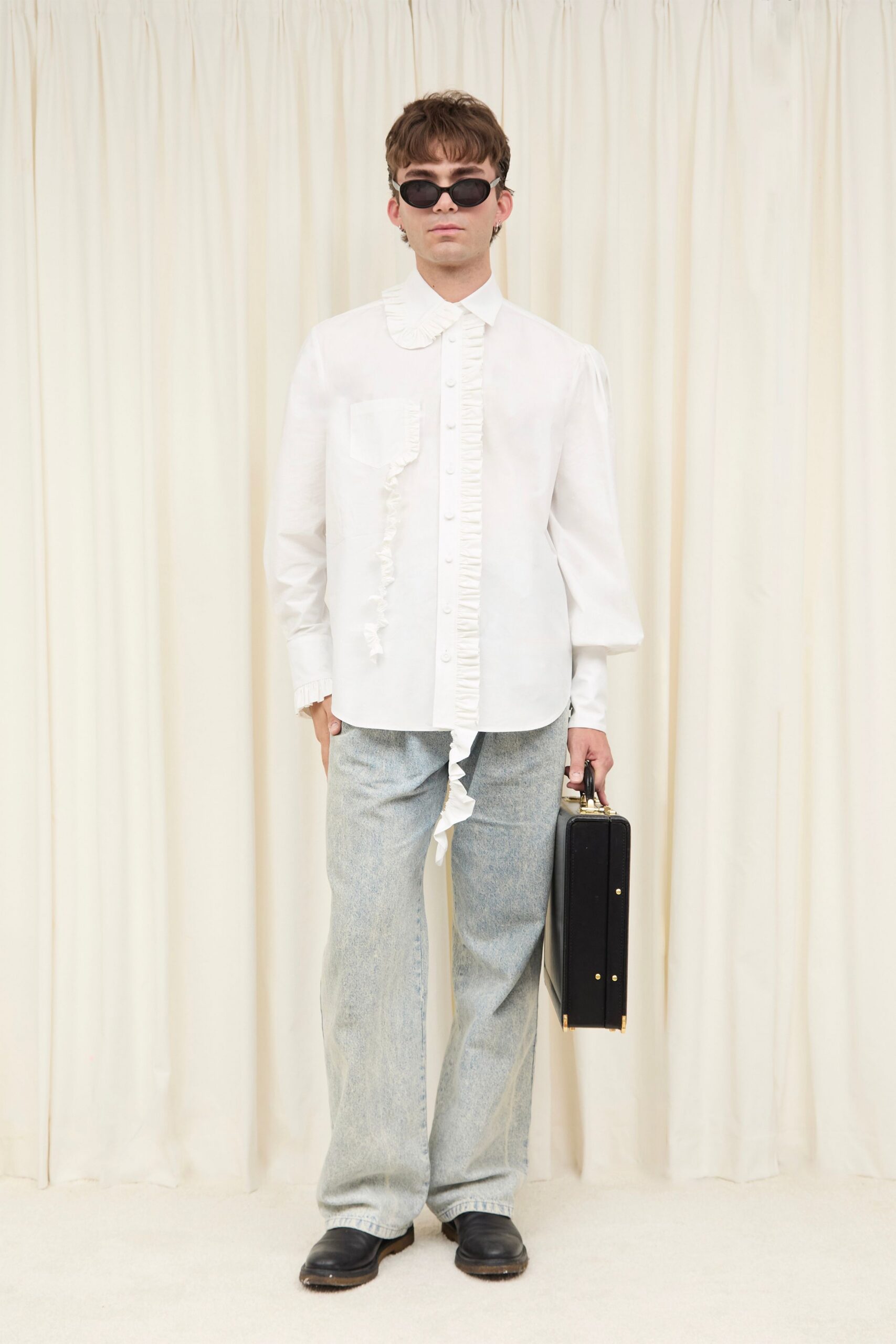 white ruffled shirt with denim pants